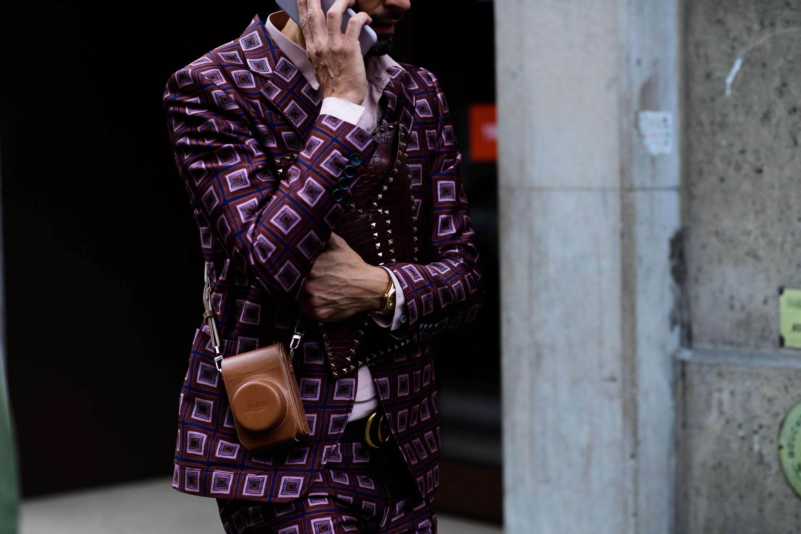 Italian journalist wearing purple suit