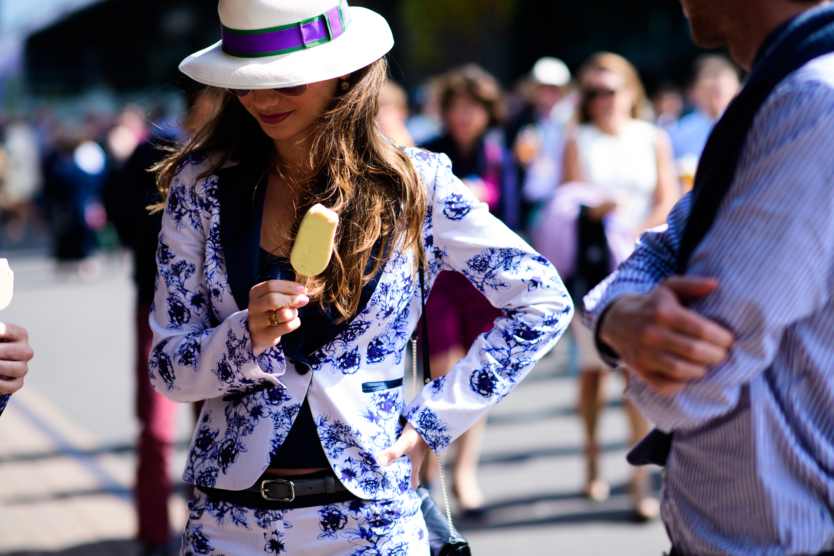 Woman wearing white hat and suit