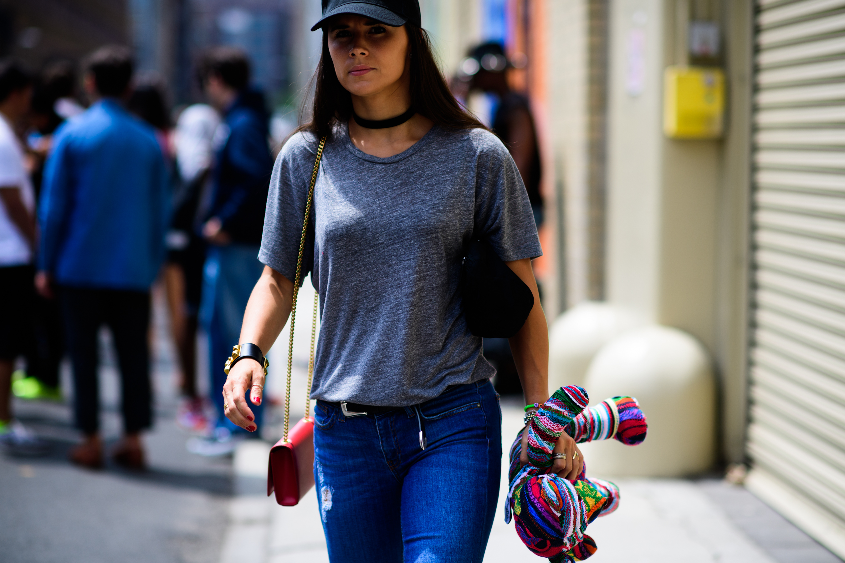 Woman wearing grey shirt and hat