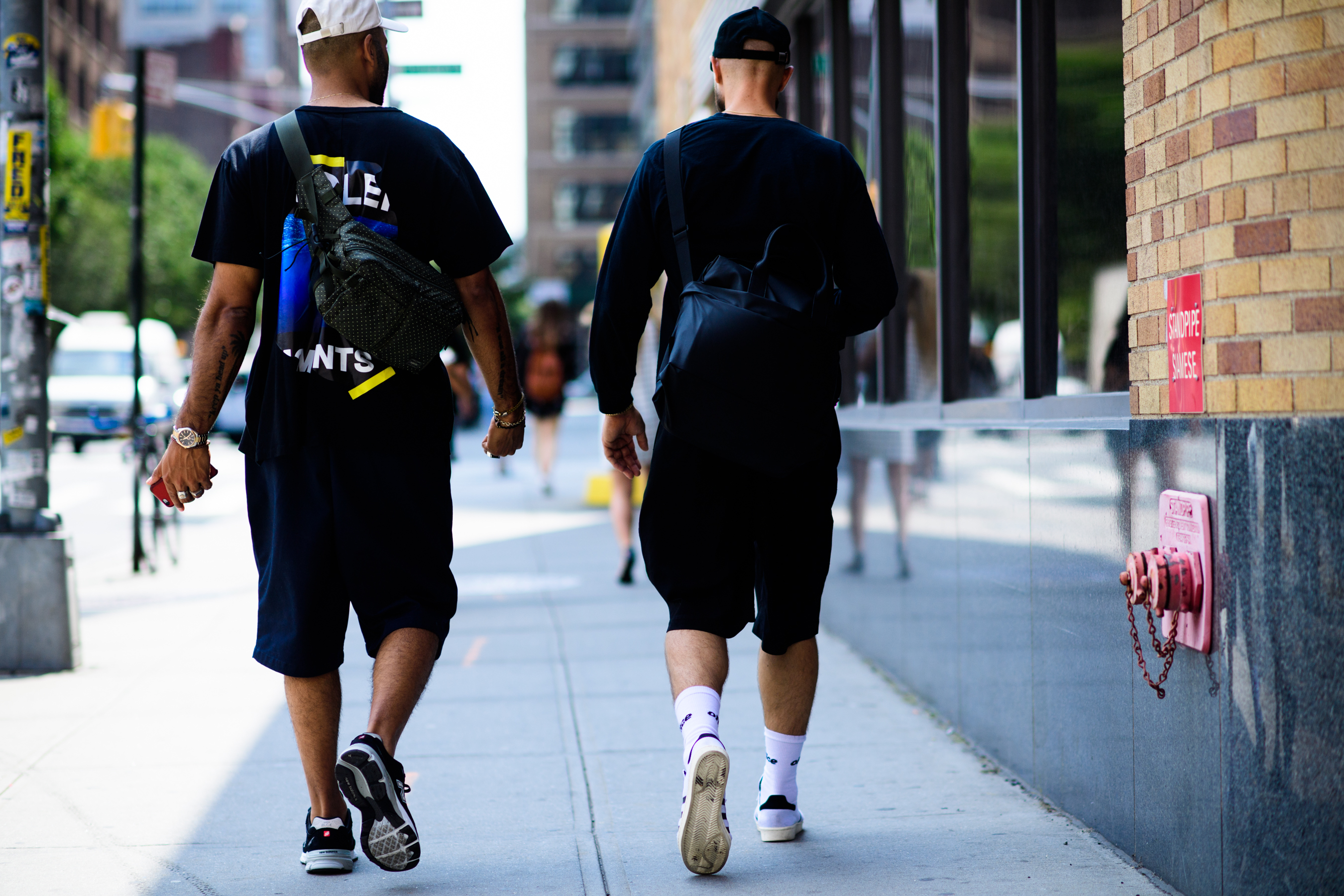 Two menswear stylists after the show