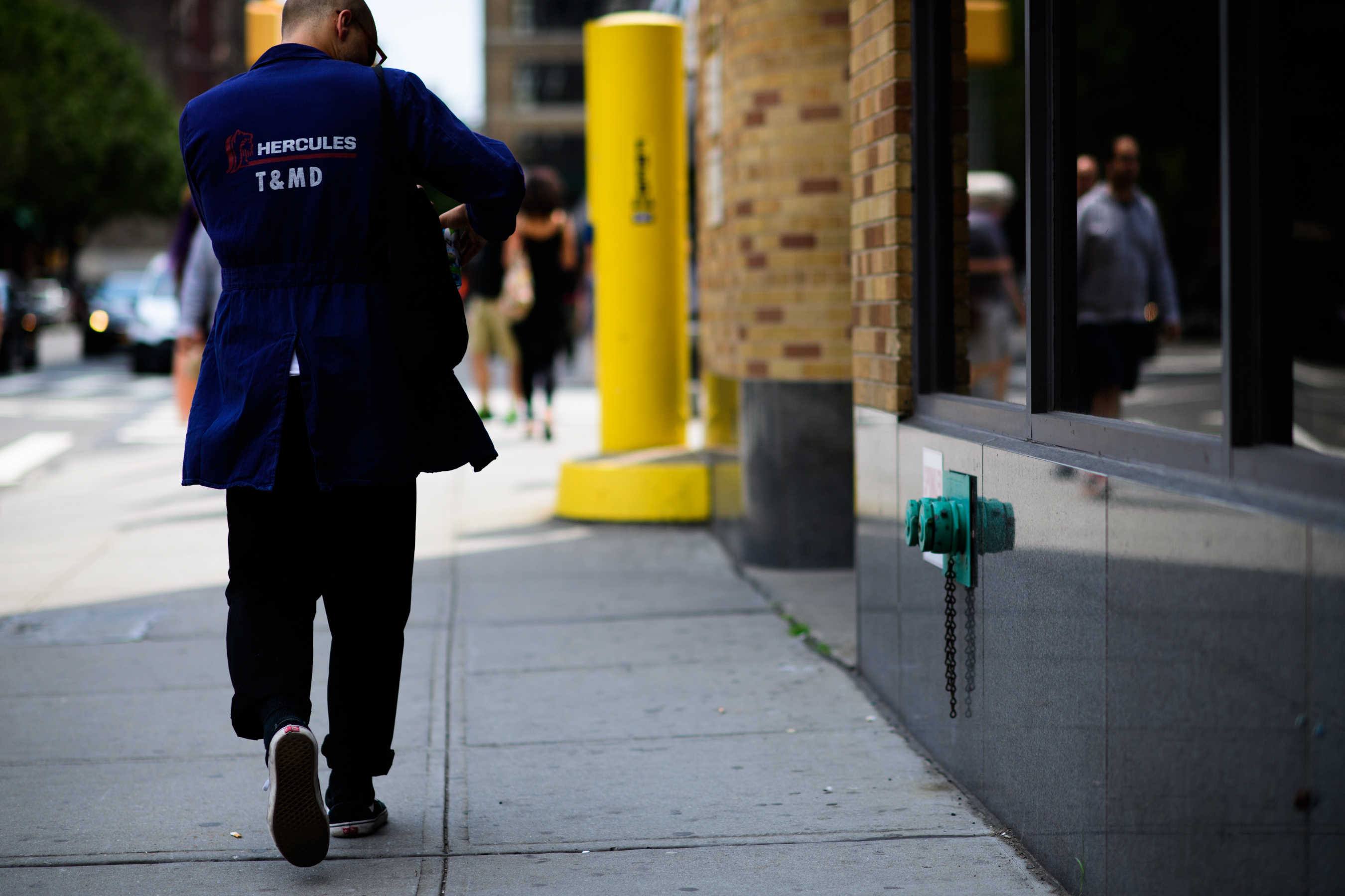 Man wearing blue workwear jacket