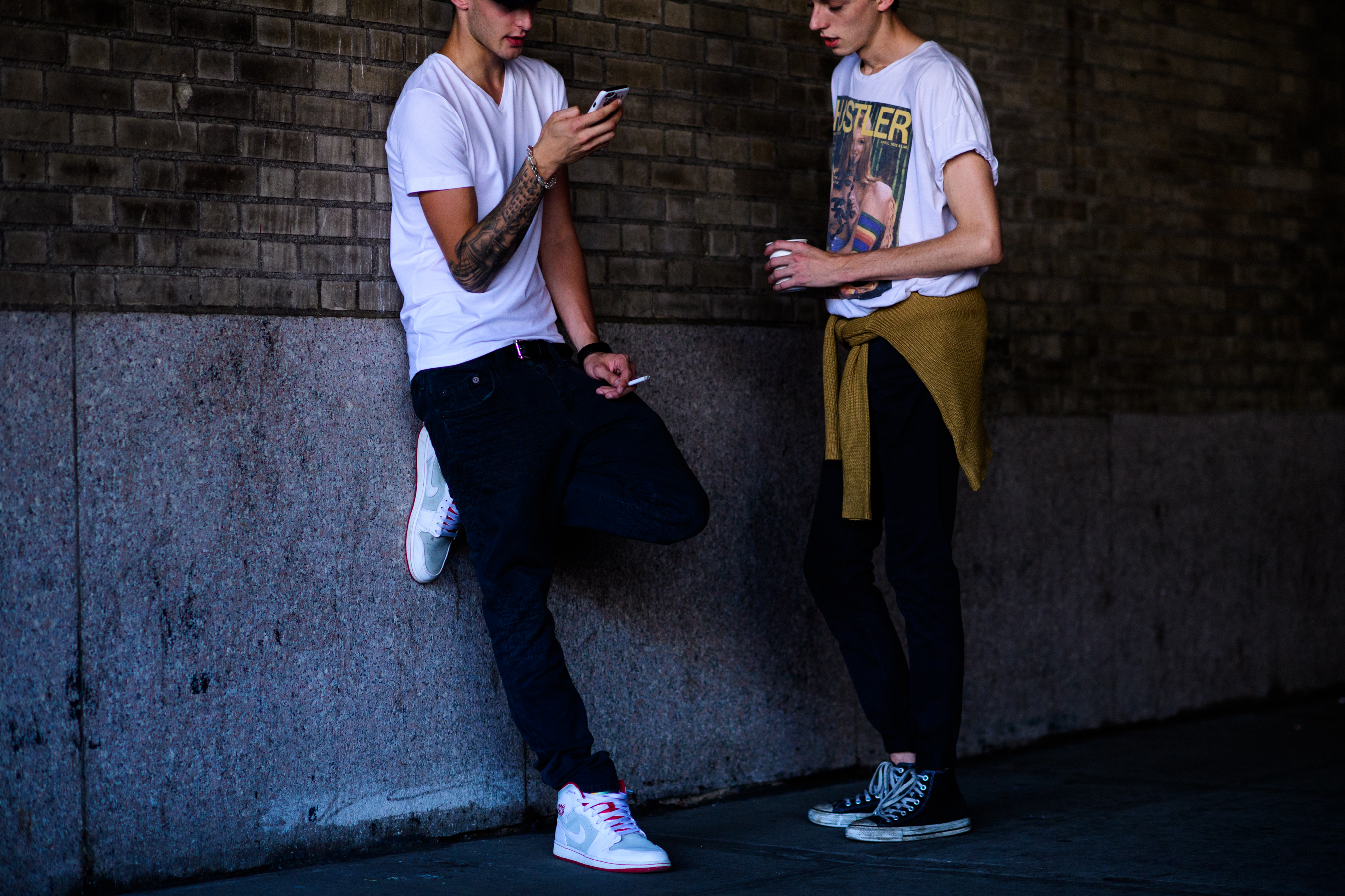 Two male model wearing white t-shirts