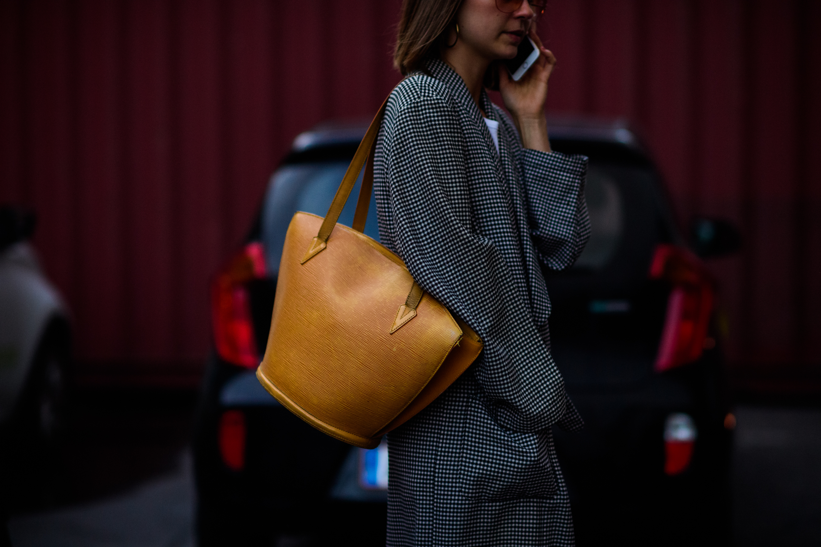 Woman with beige leather bag