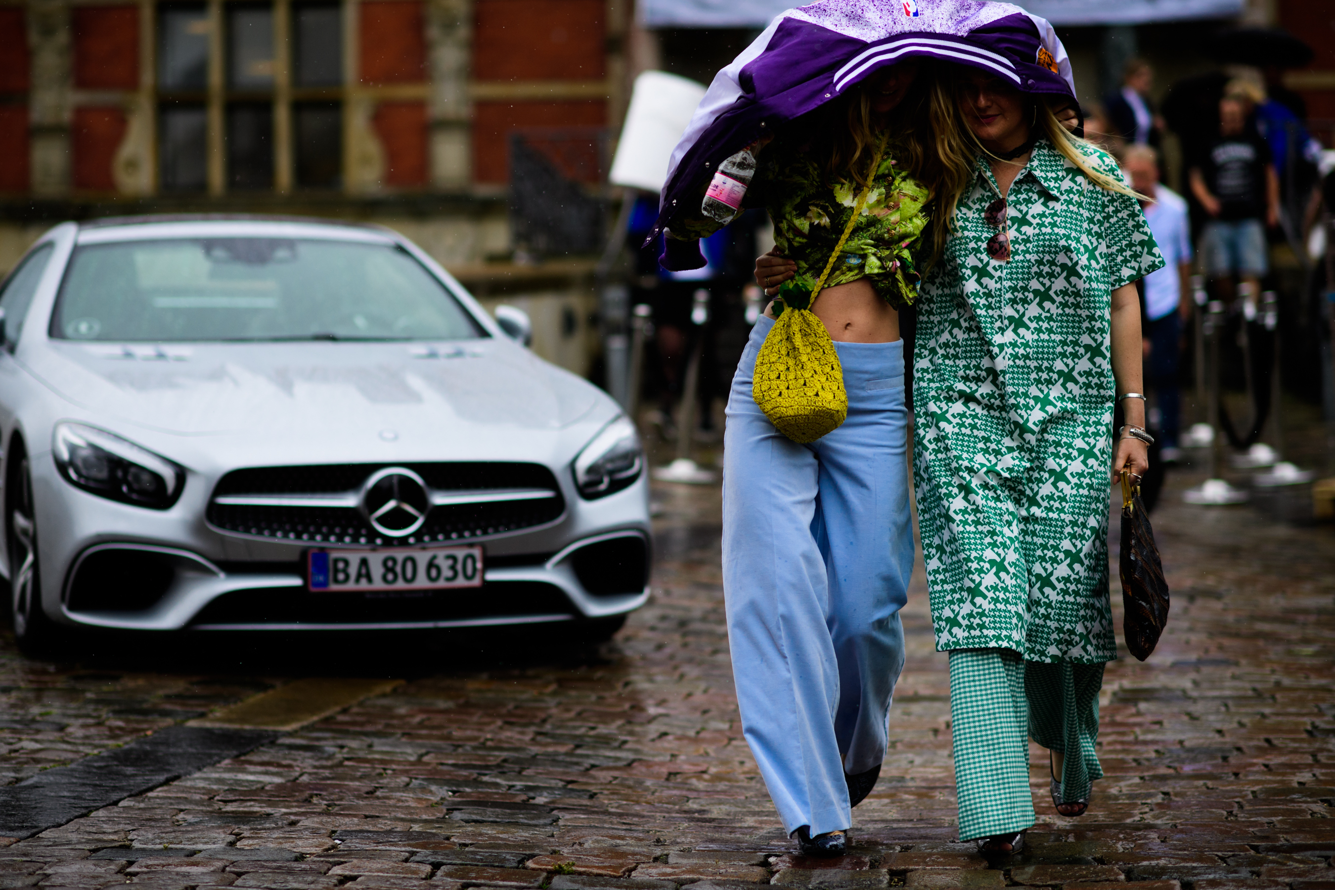 Two women dressed in colourful clothes
