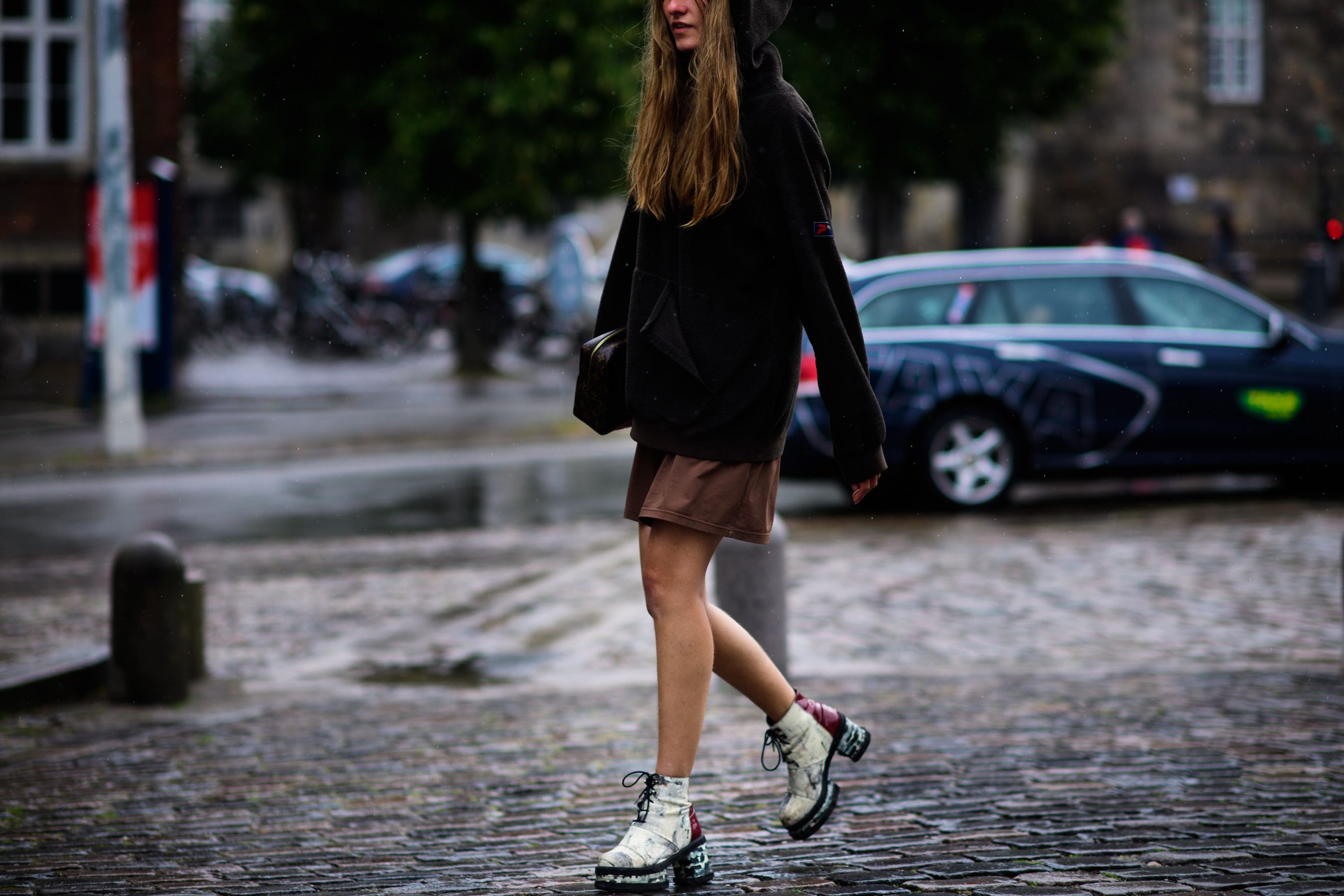 Woman wearing boots and mini skirt