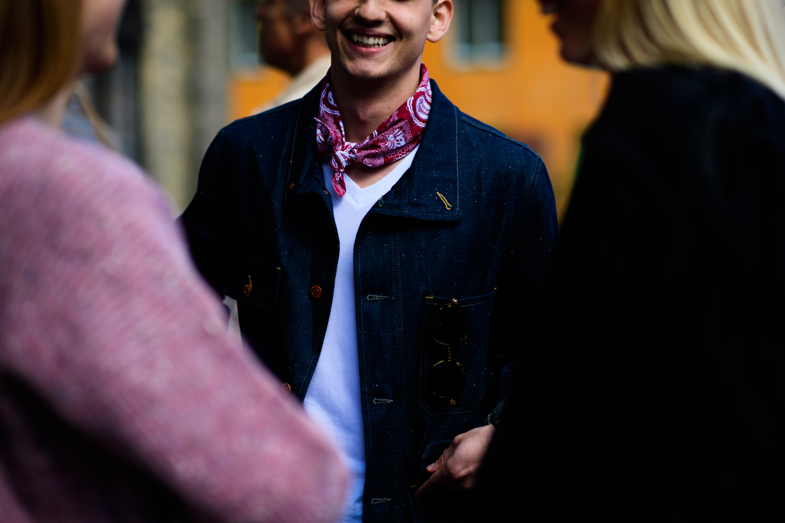 Man wearing red neck scarf