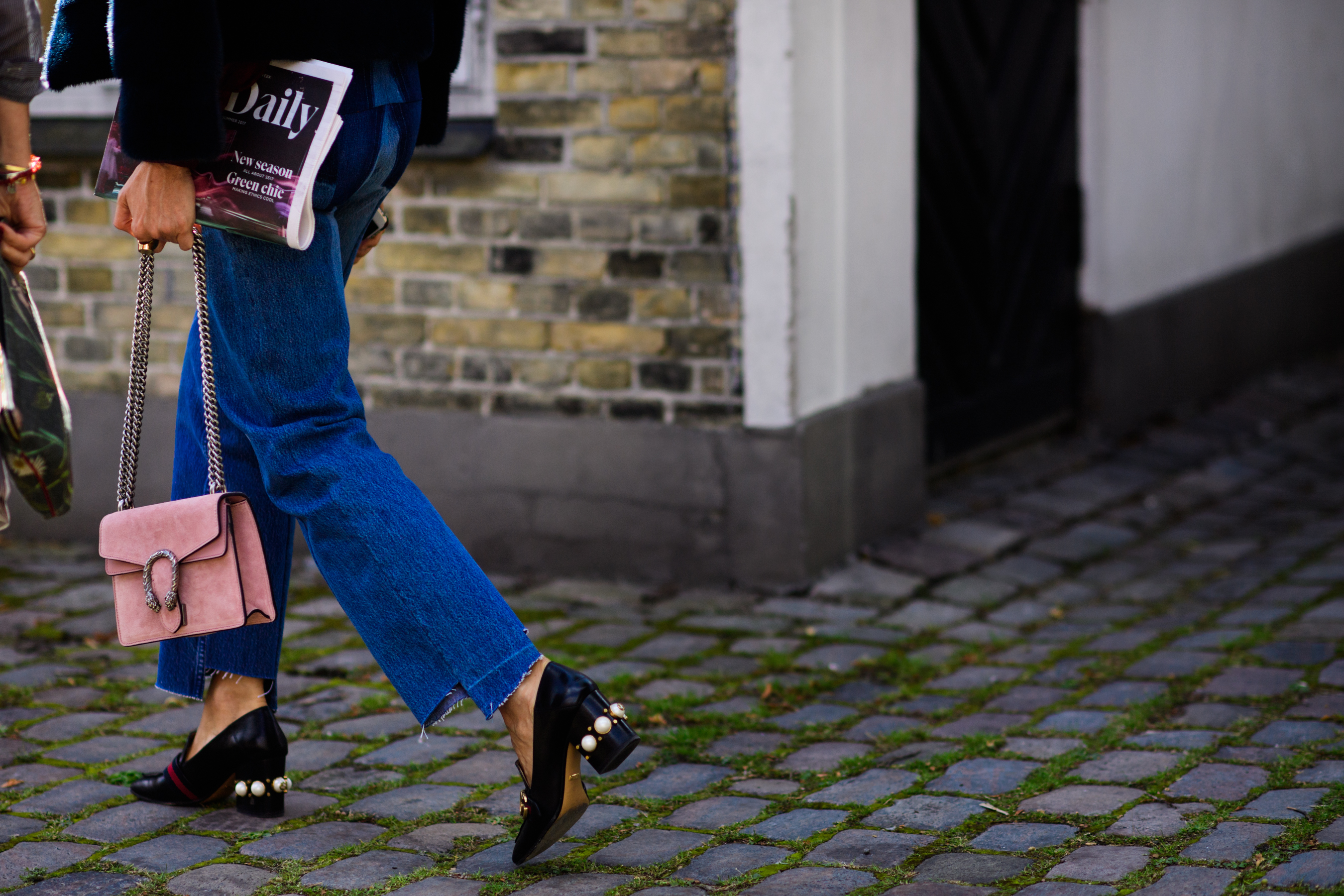 Woman wearing asymmetrically cropped jeans