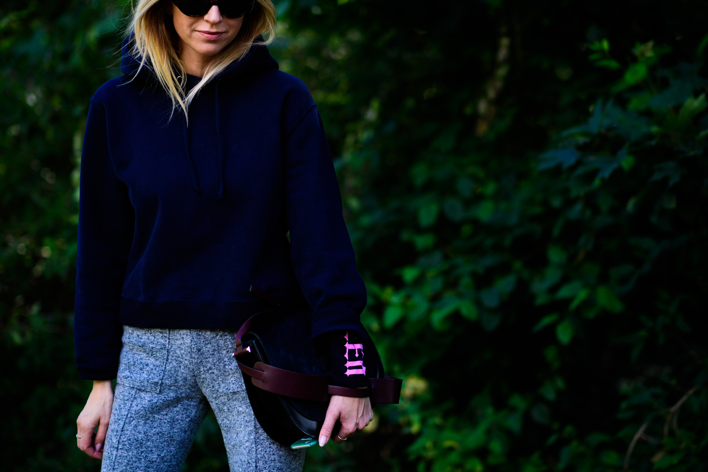 Woman wearing dark blue hoodie
