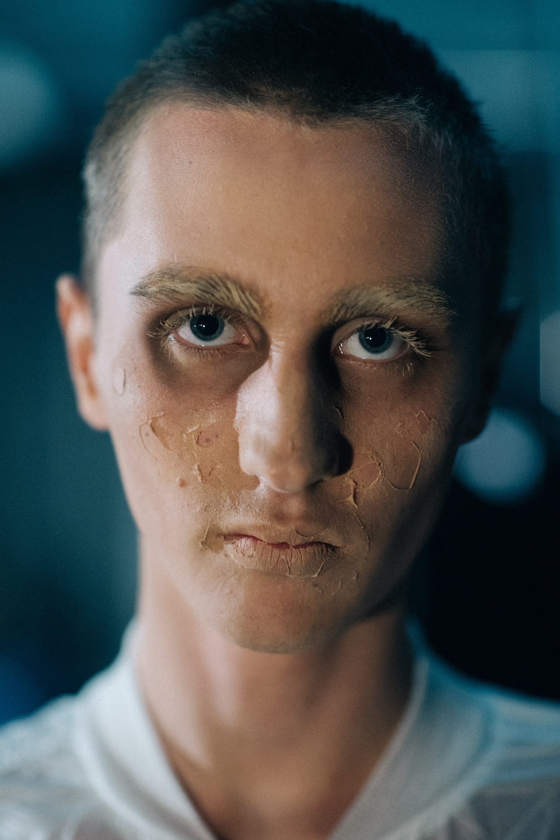 Portrait of a male model creepy make up