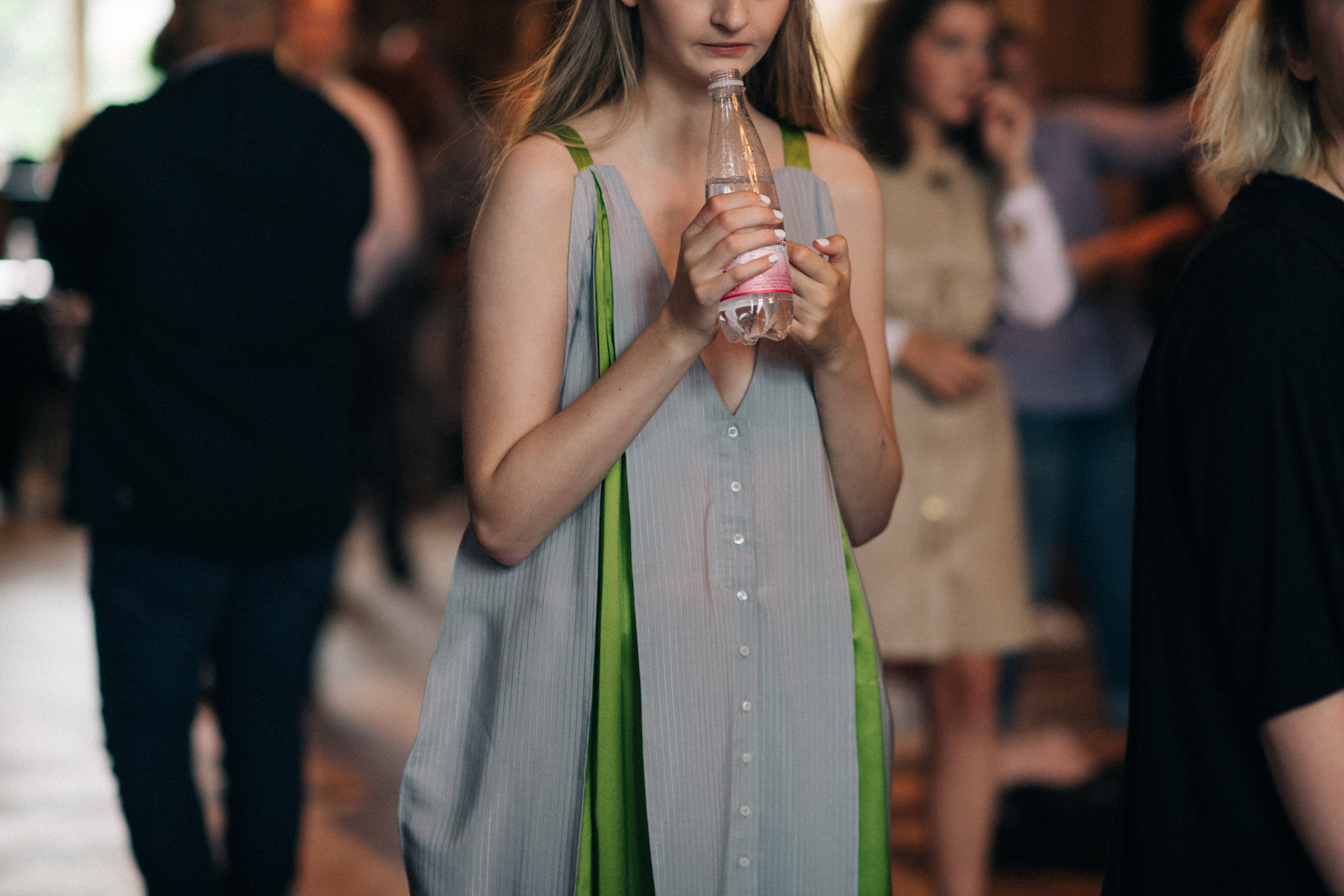Model wearing dress before the show