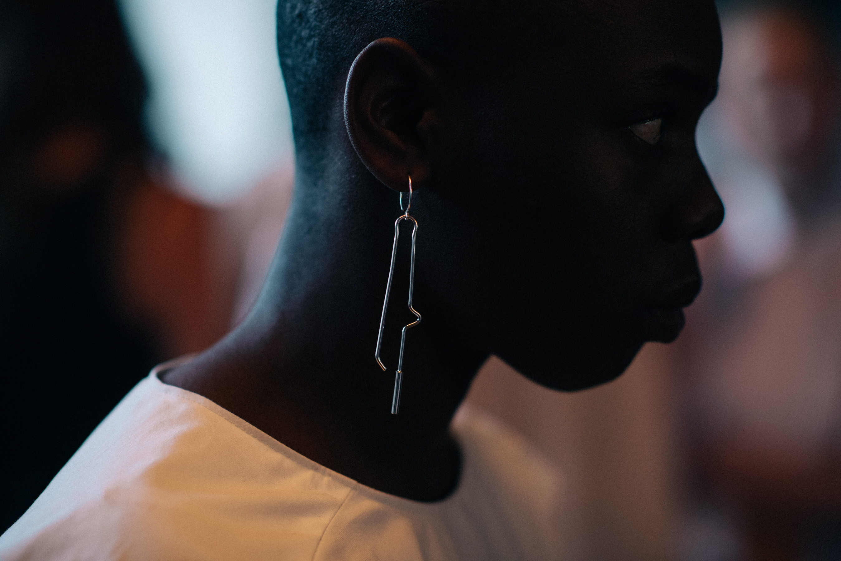 Model with long metal earring