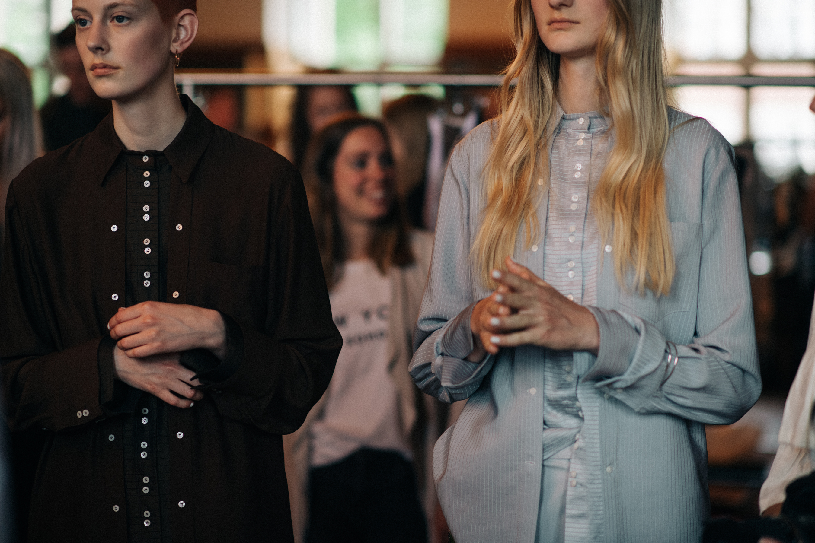 Two models wearing shirt dresses