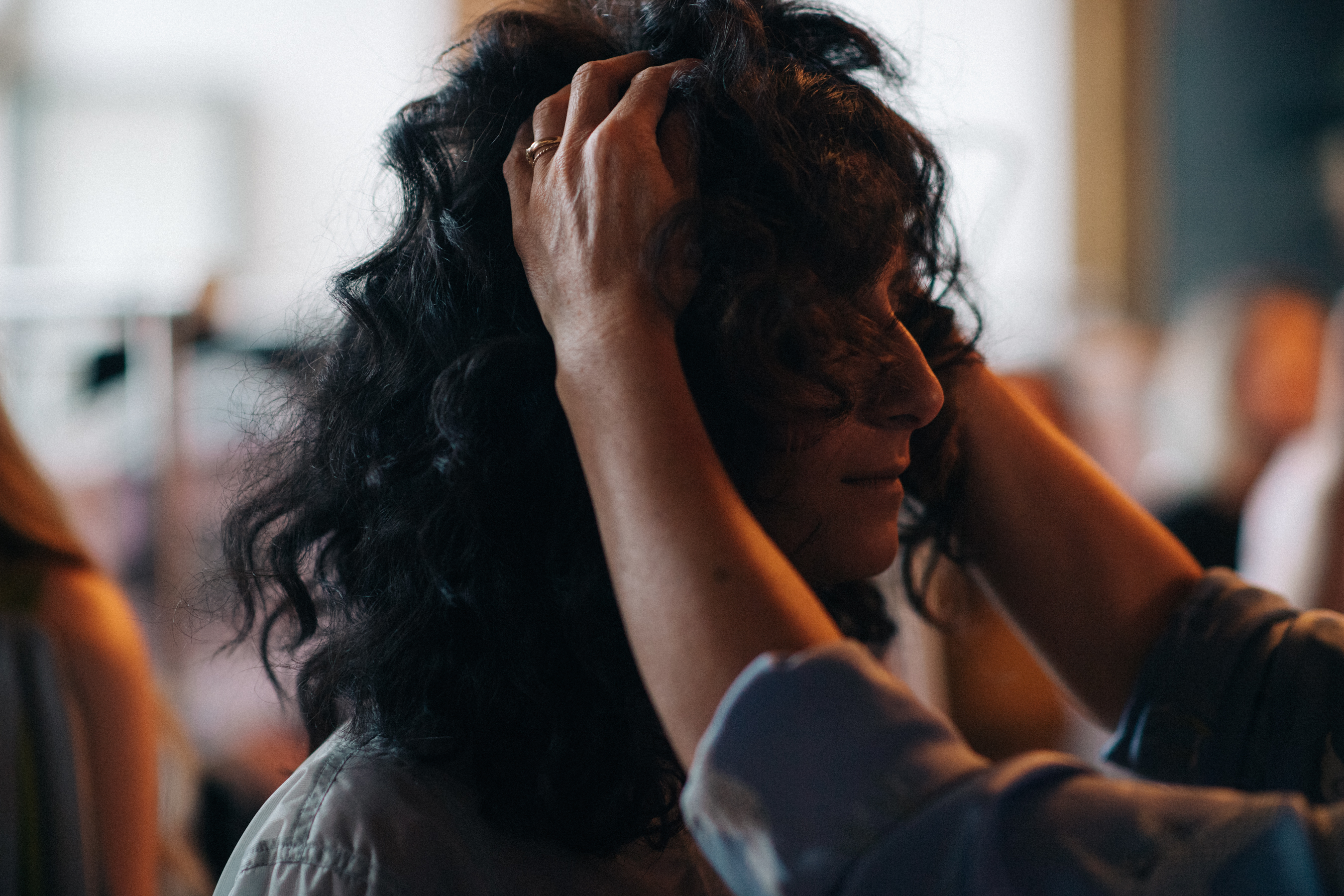 Model with dark curly hair