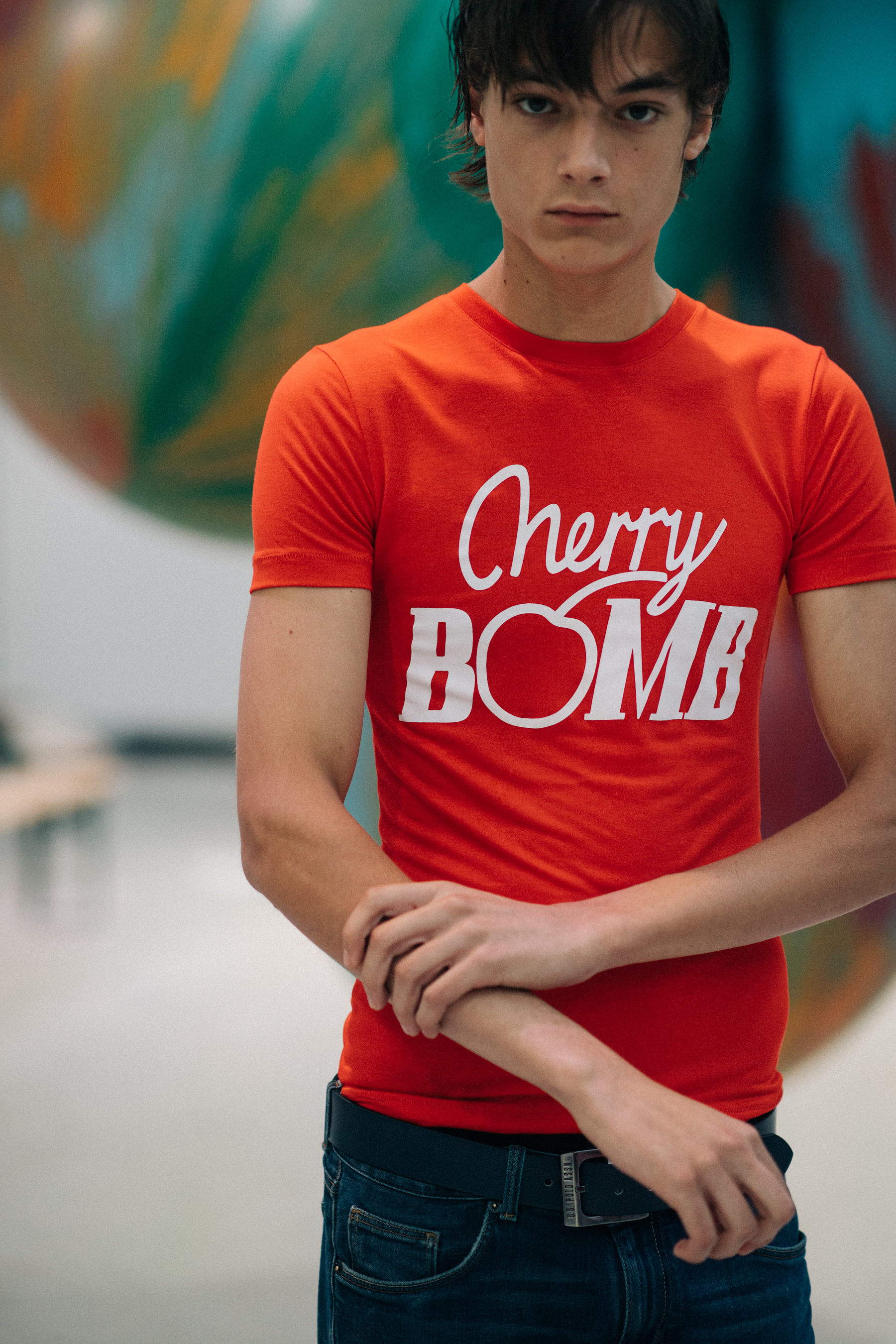 Male model wearing red t-shirt