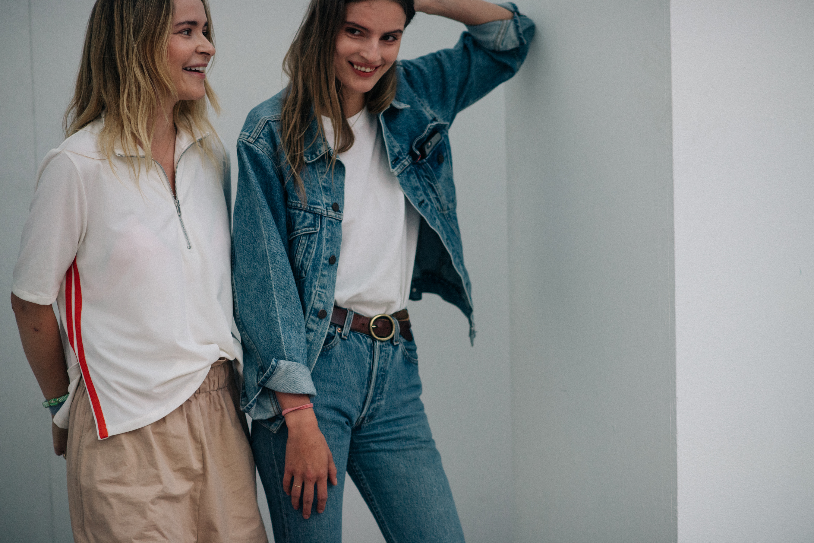 Two models laughing before show