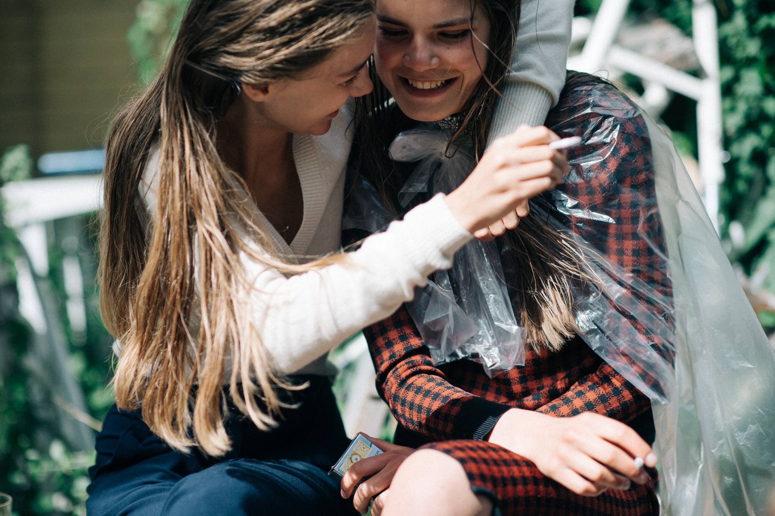 Two models laughing before the show
