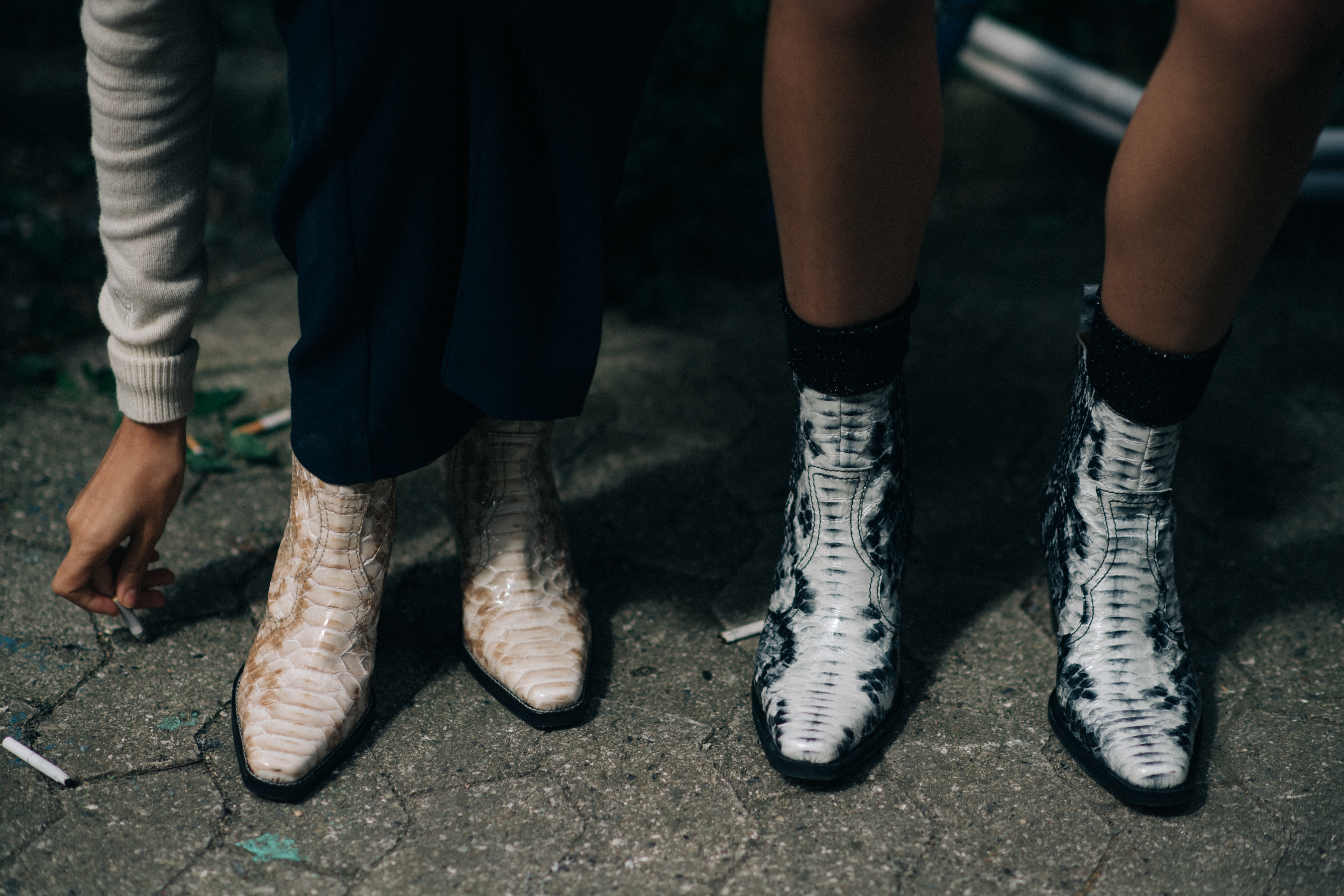 Two models wearing leather shoes