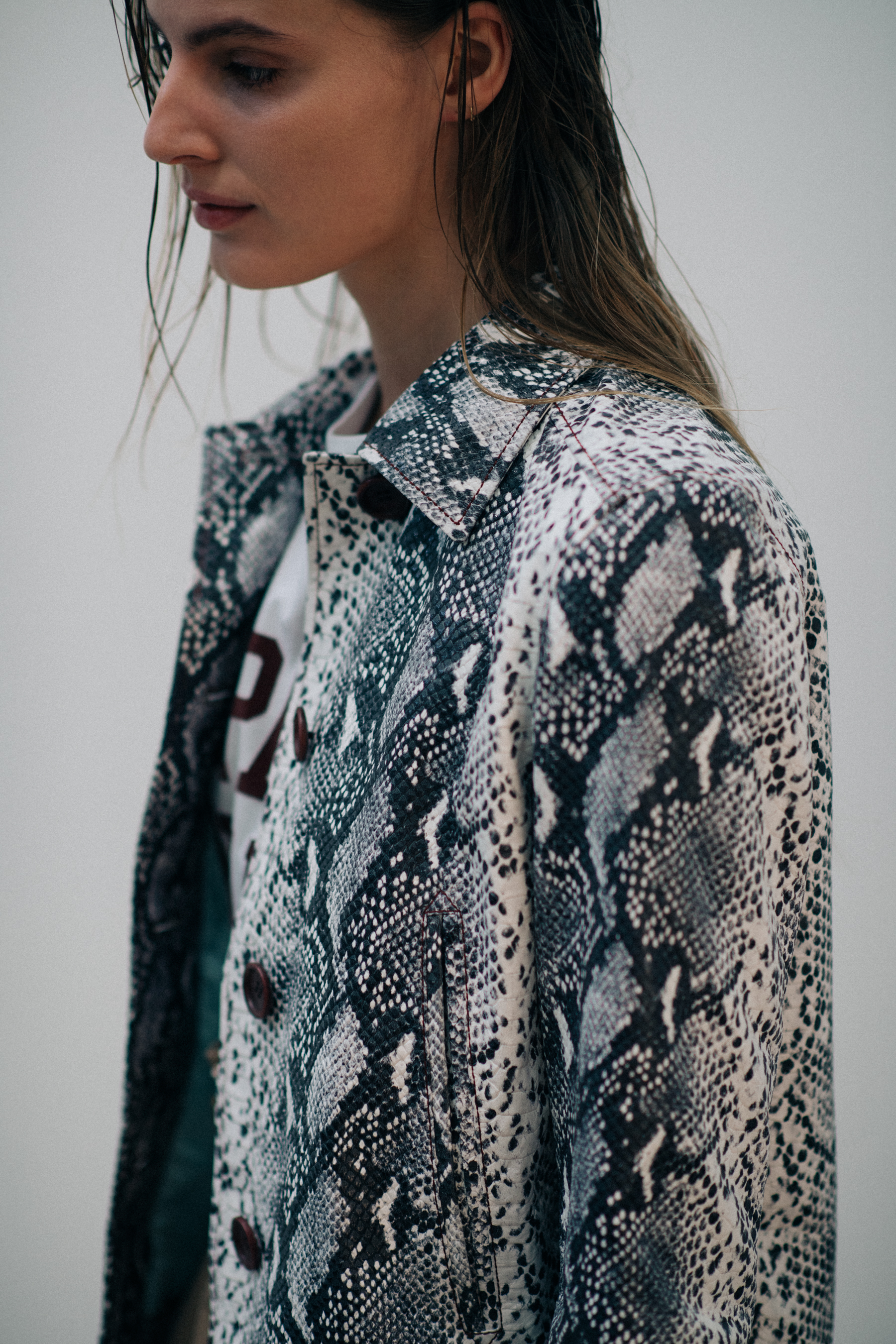 Model wearing snake skin coat