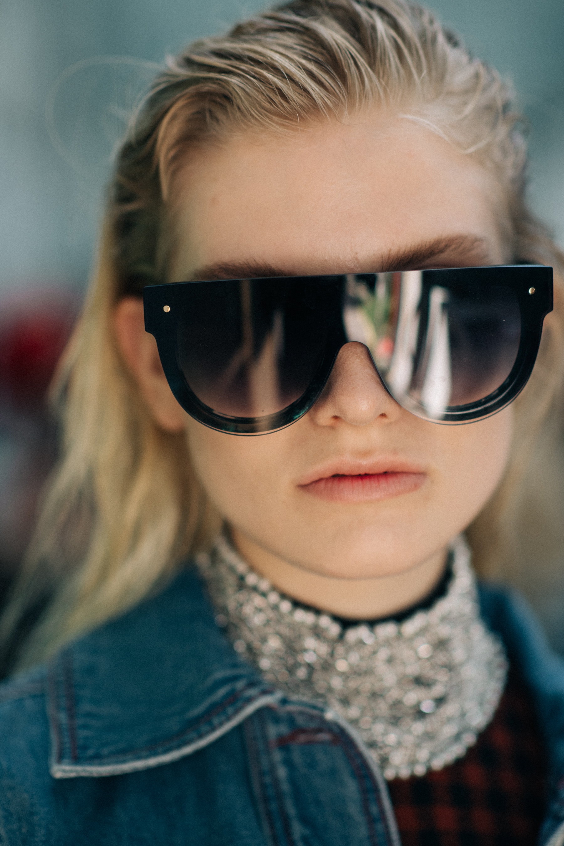 Portrait of a blonde model wearing glasses