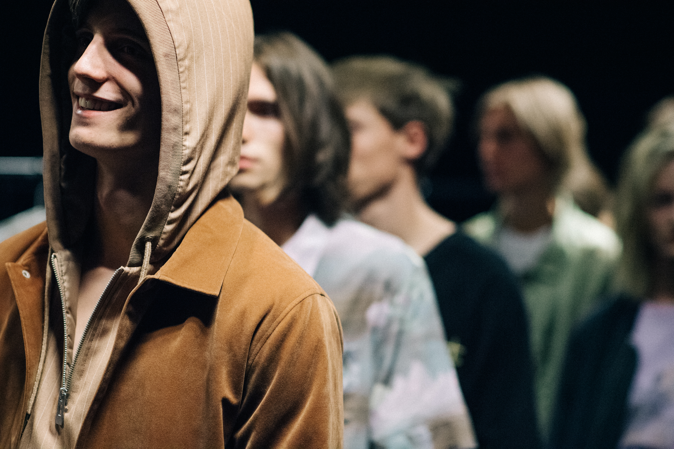 Model wearing beige hood