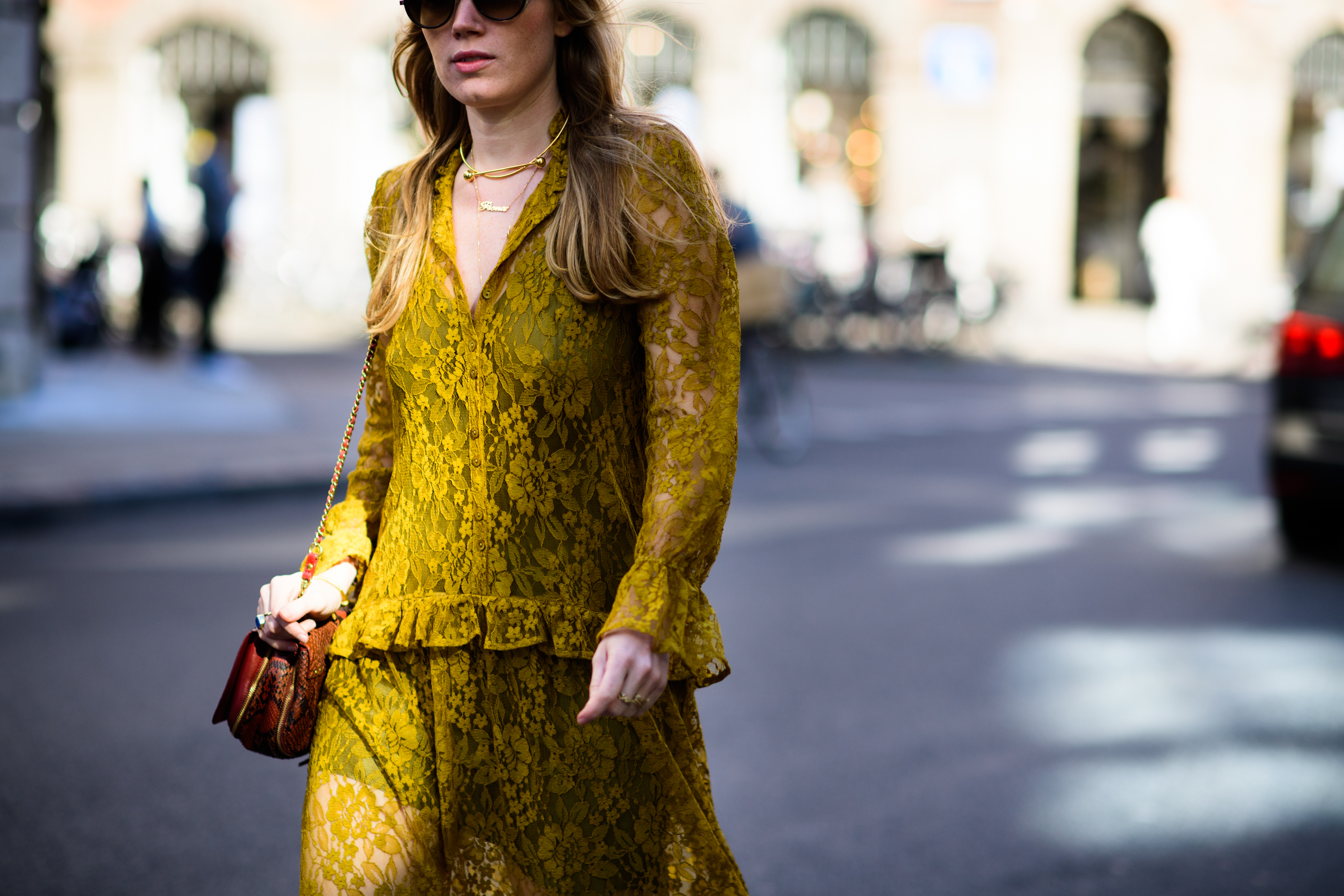 Woman wearing mustard colour dress