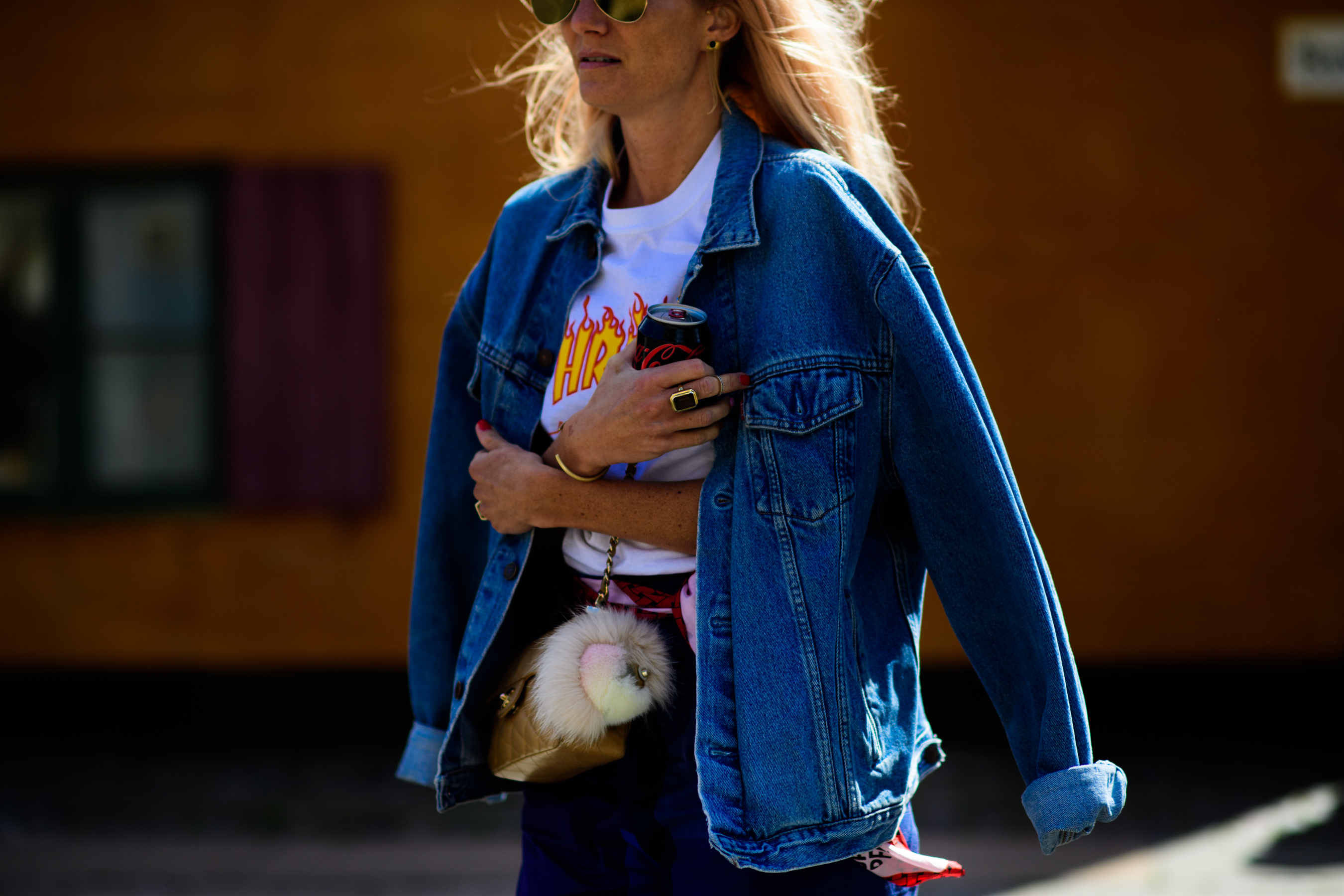 Woman wearing Thrasher and denim jacket