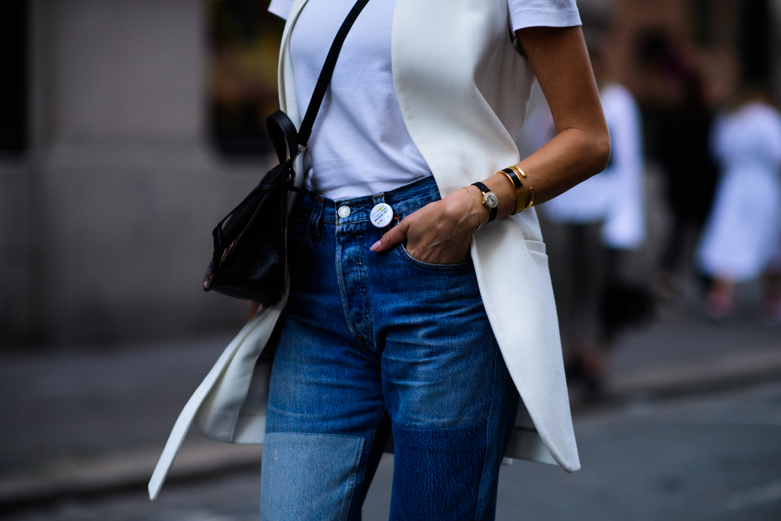 Woman wearing jeans and white waistcoat