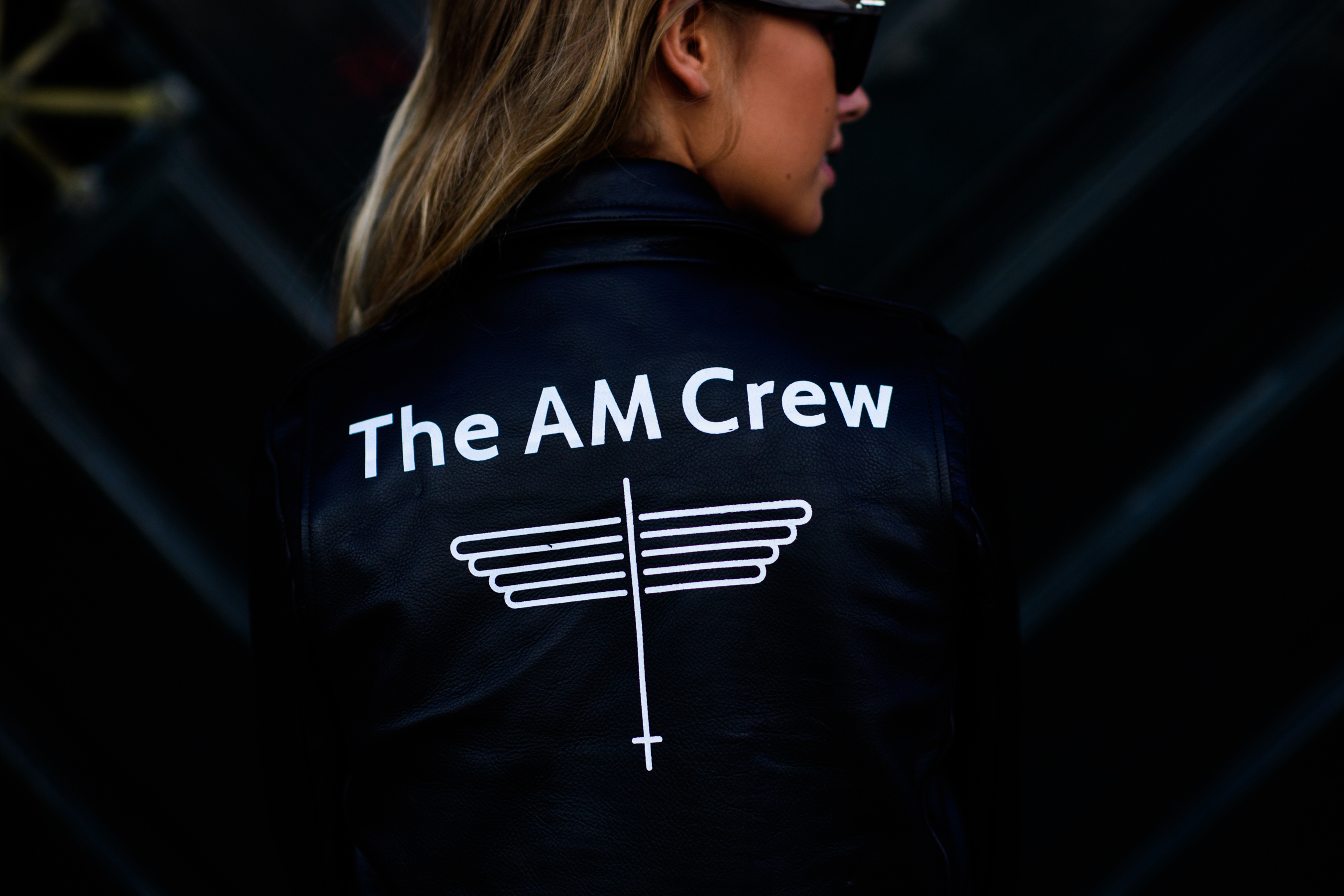 Girl wearing The AM Crew jacket