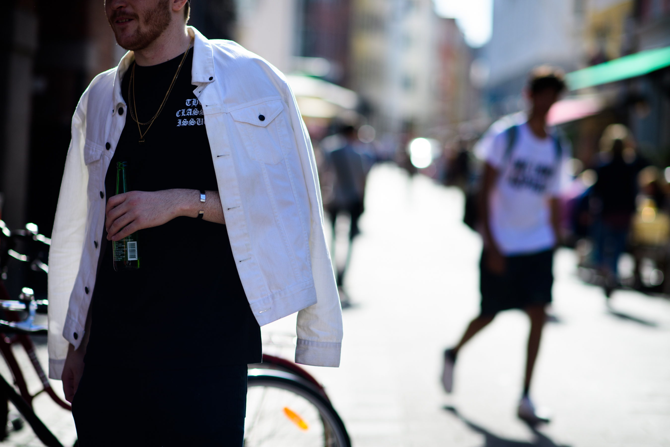 Man wearing white denim jacket