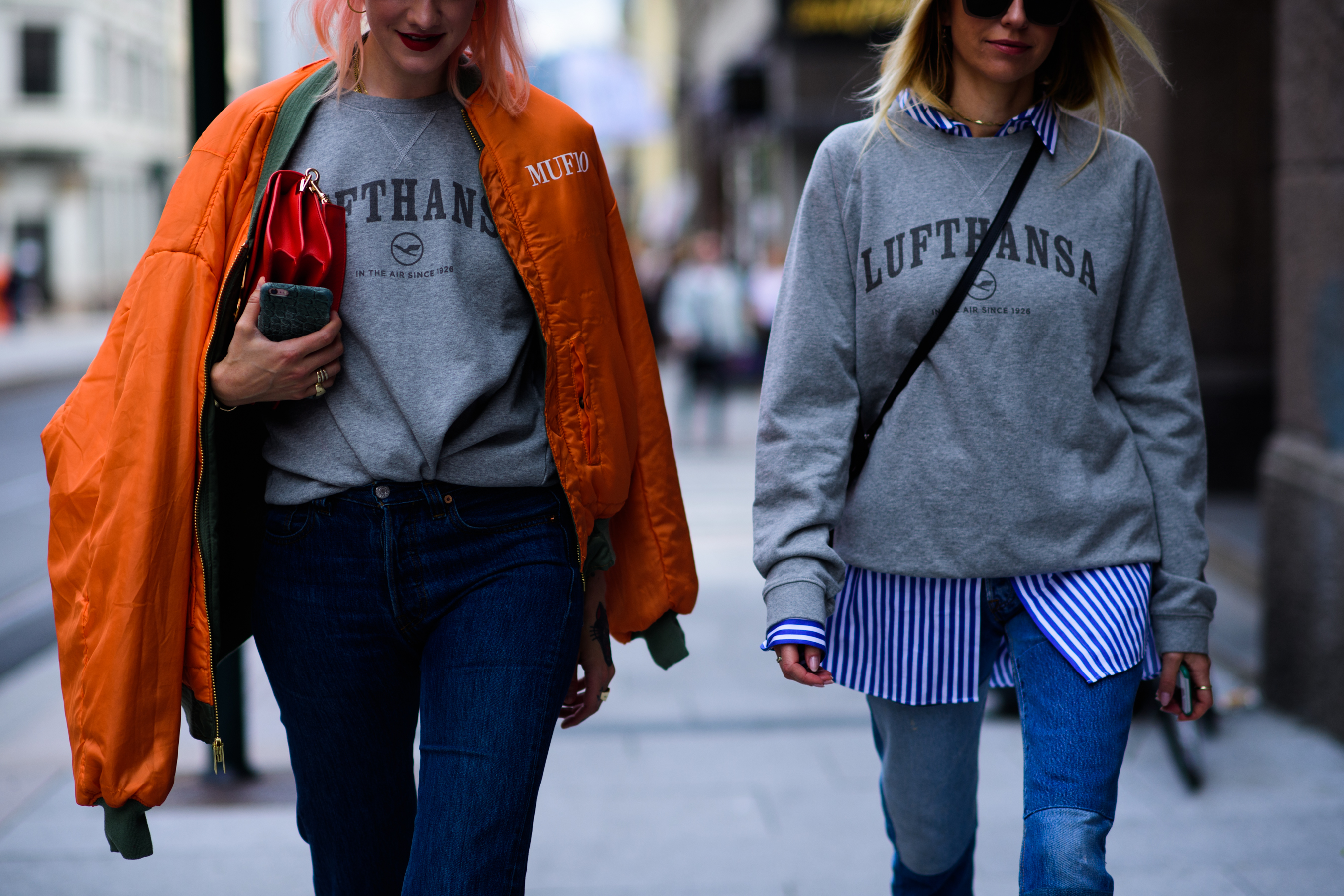 Two women wearing Lufthansa sweatshirts