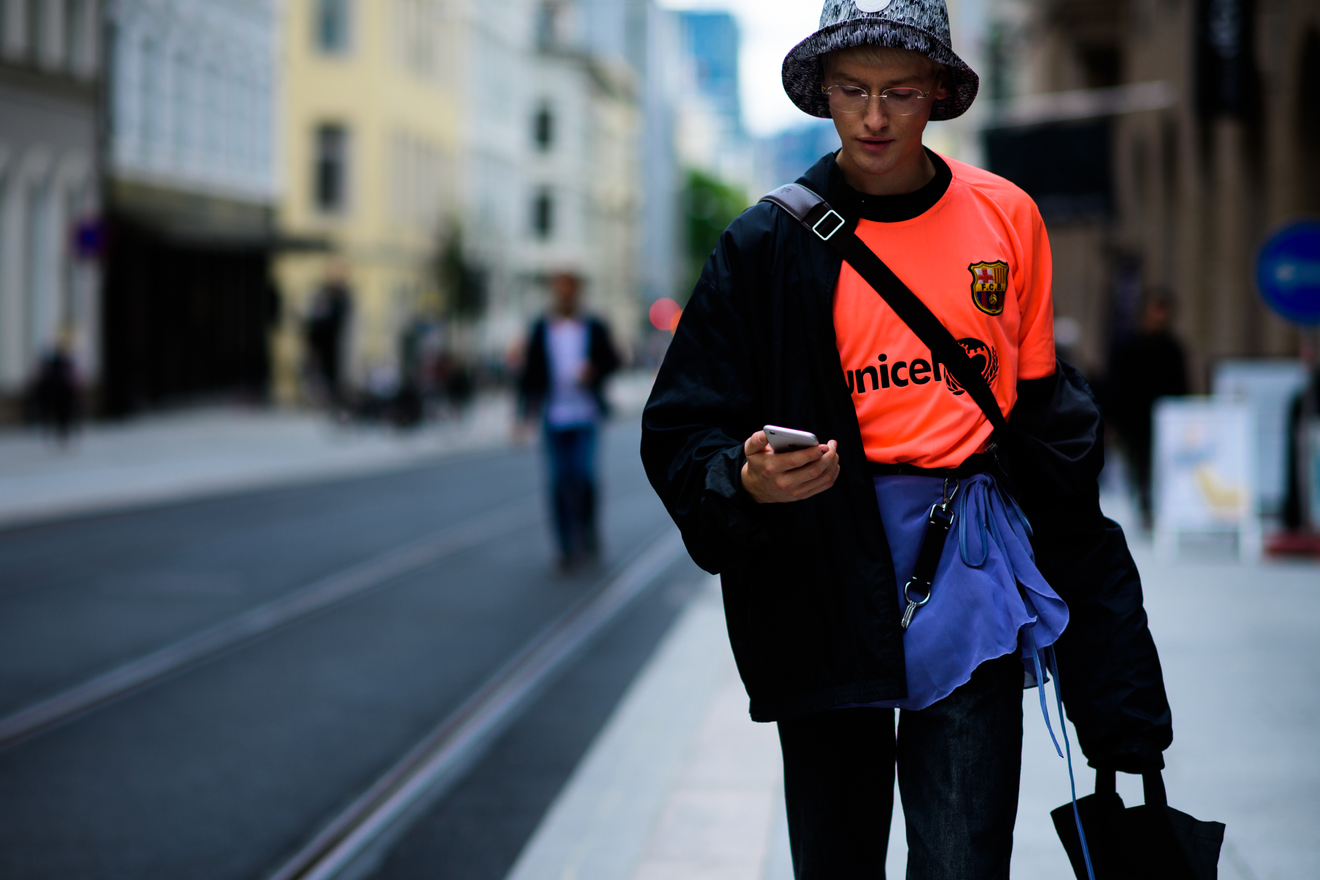 Boy wearing bright orange soccer jersey