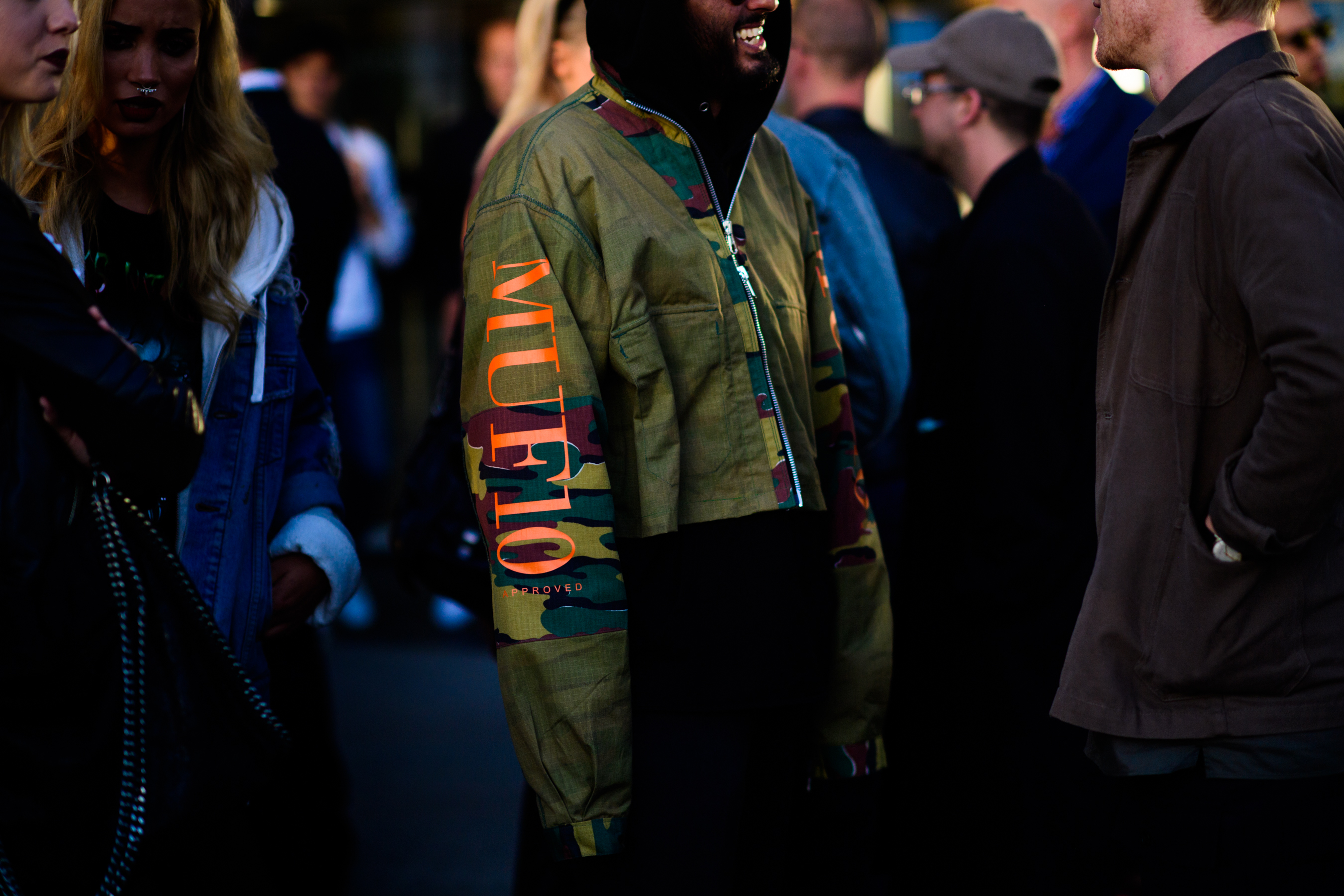 Man wearing camouflage oversized jacket