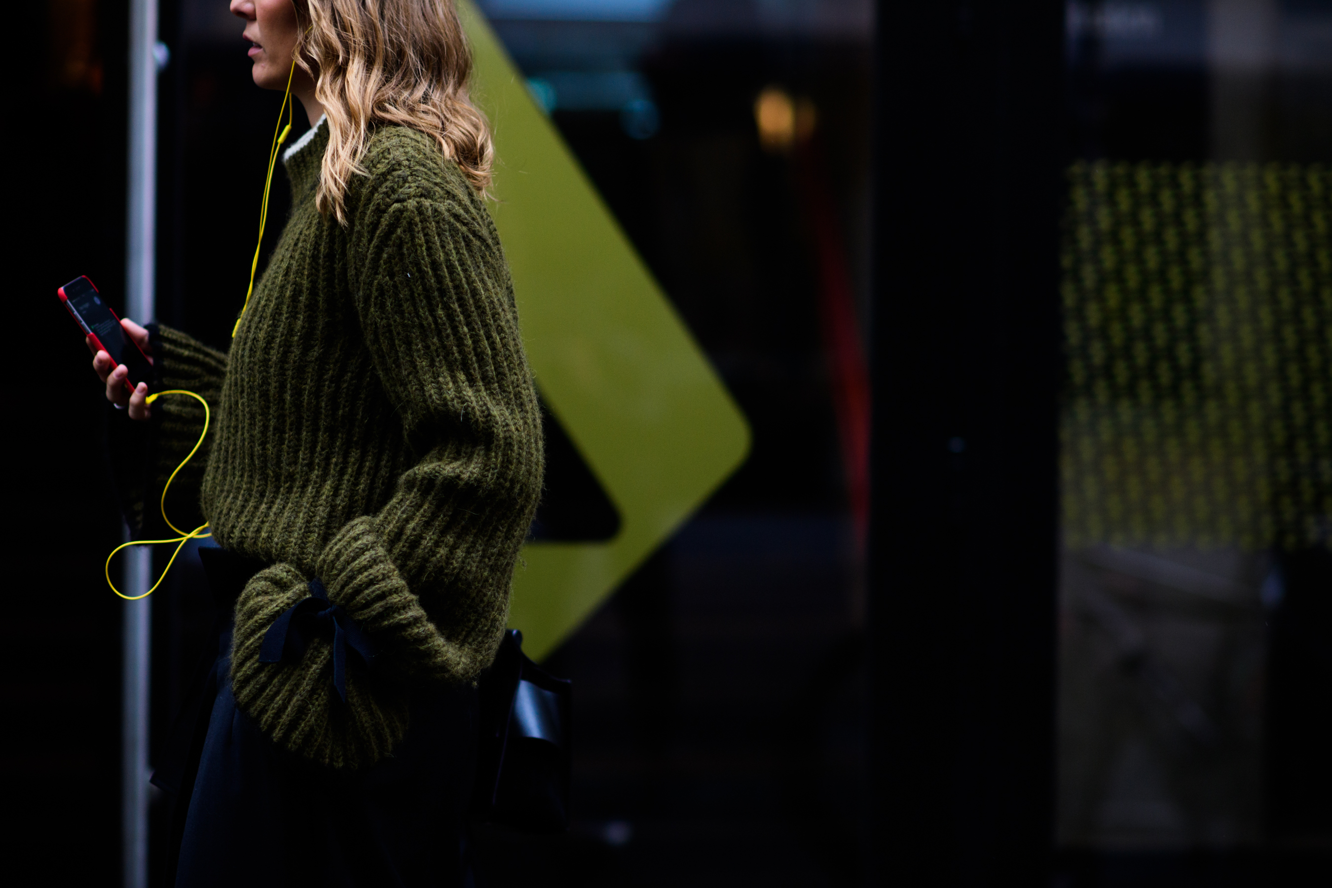 Woman wearing green oversized sweater