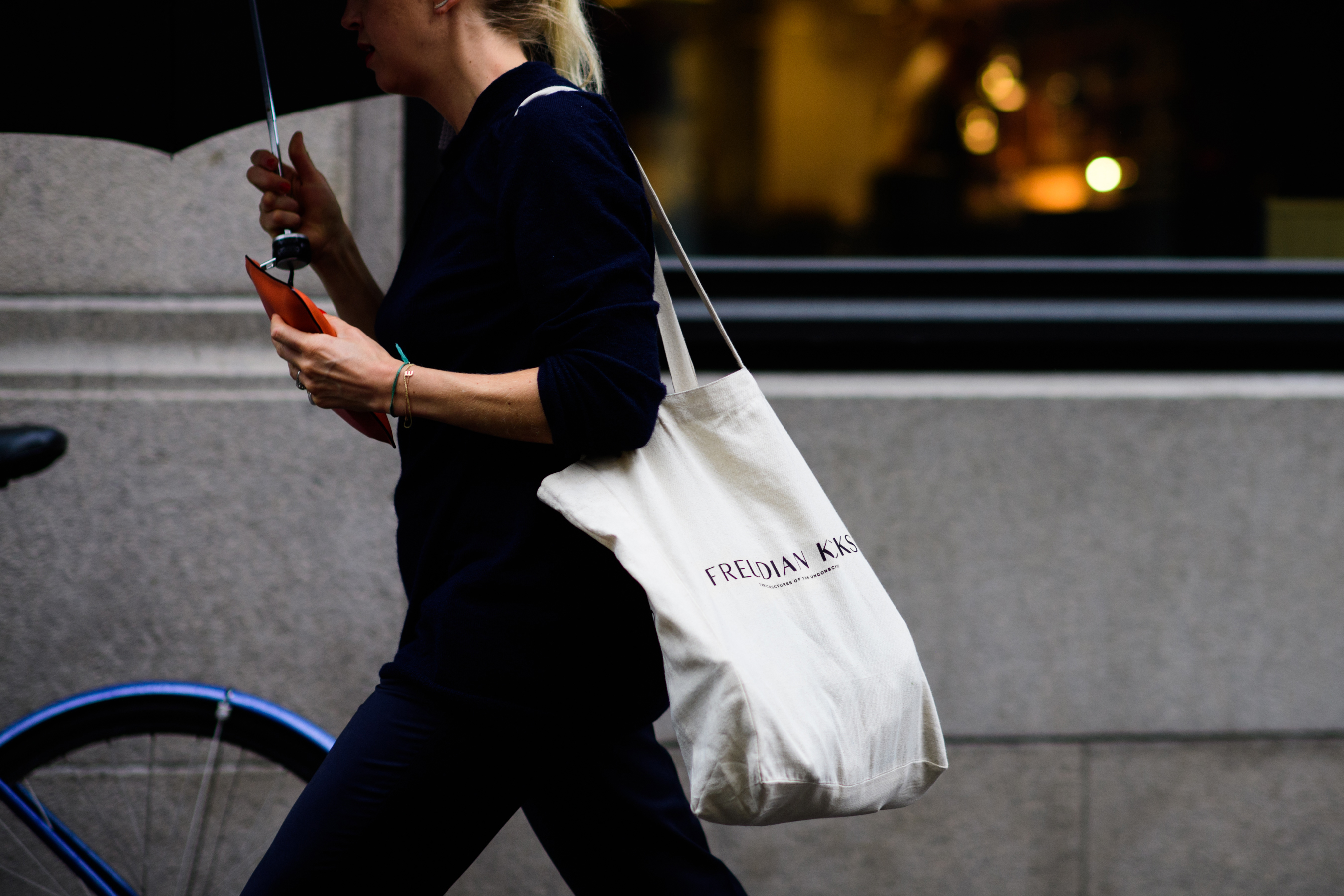 Woman with white tote bag