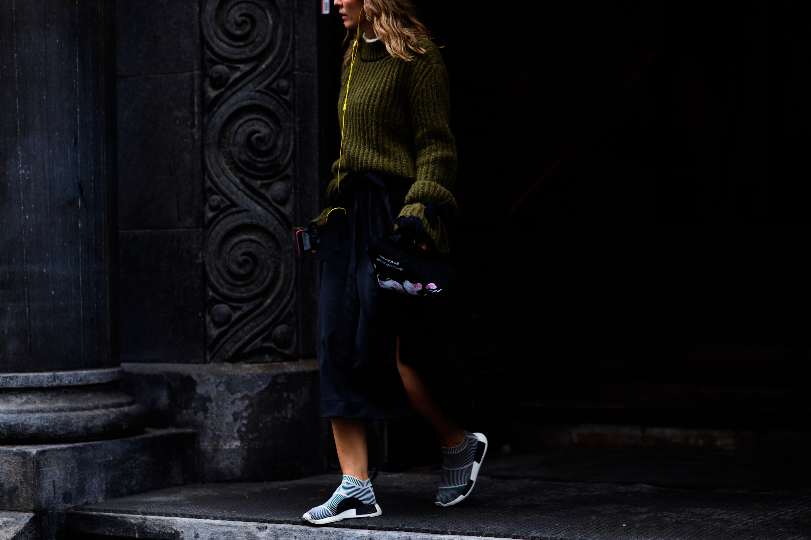 Woman wearing green sweater after show