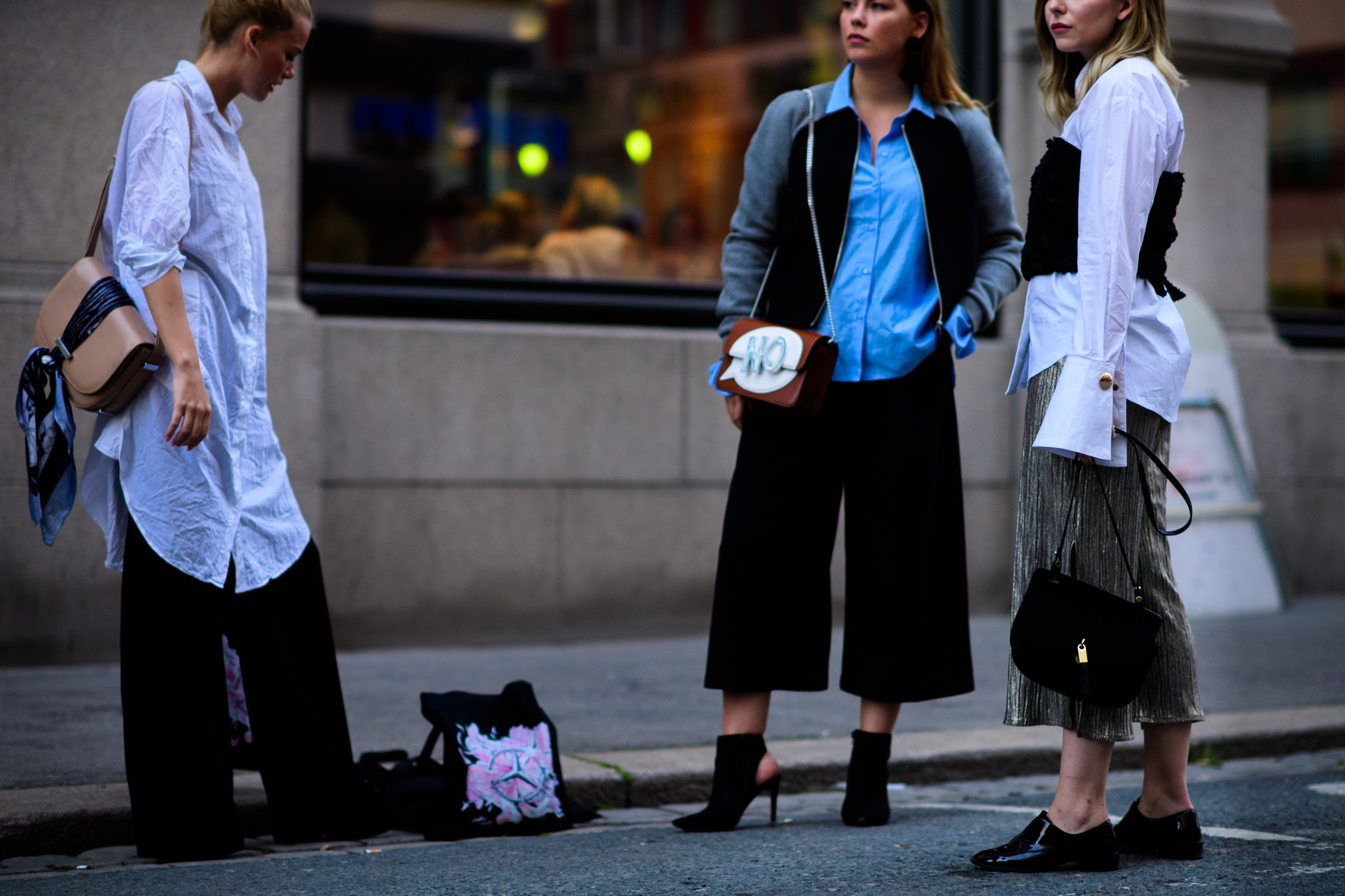 Three women wearing shirts