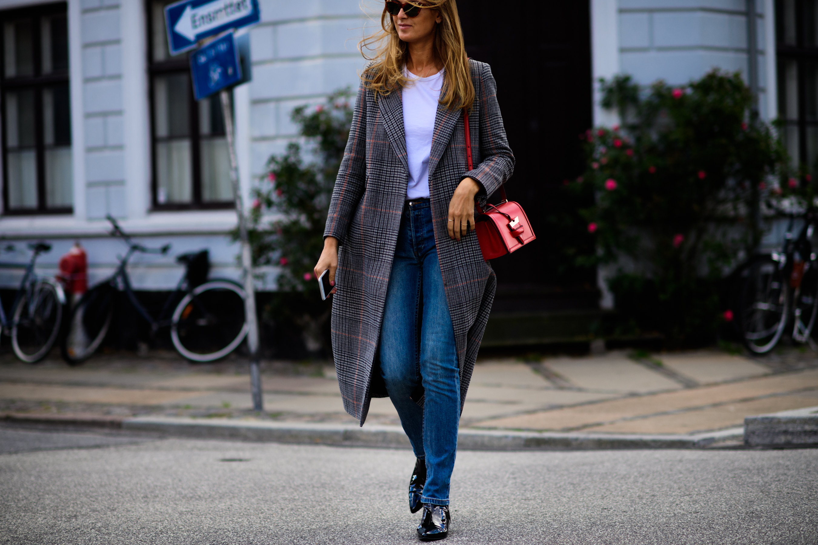 Woman wearing jeans and nice coat