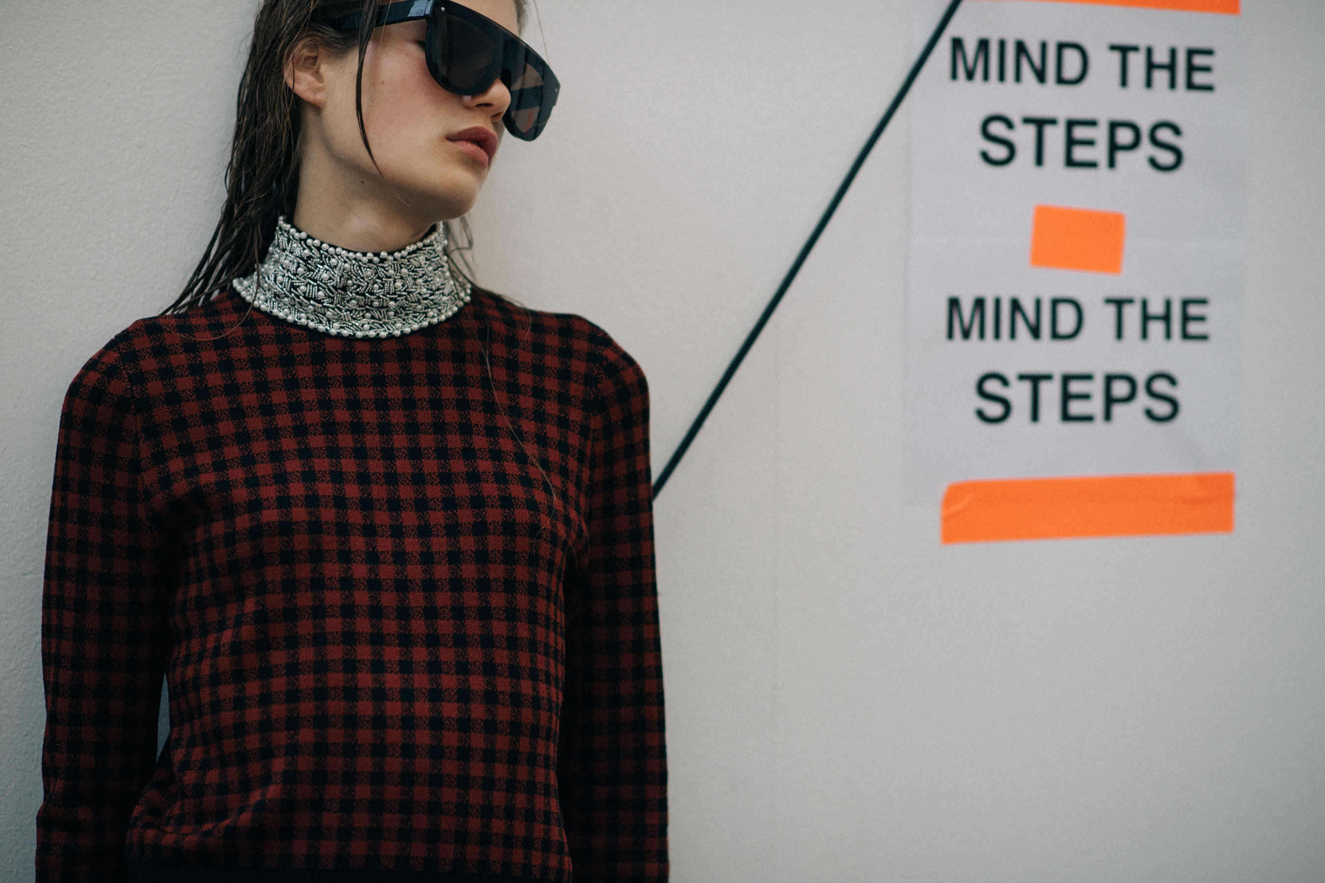 Model wearing dress and glasses