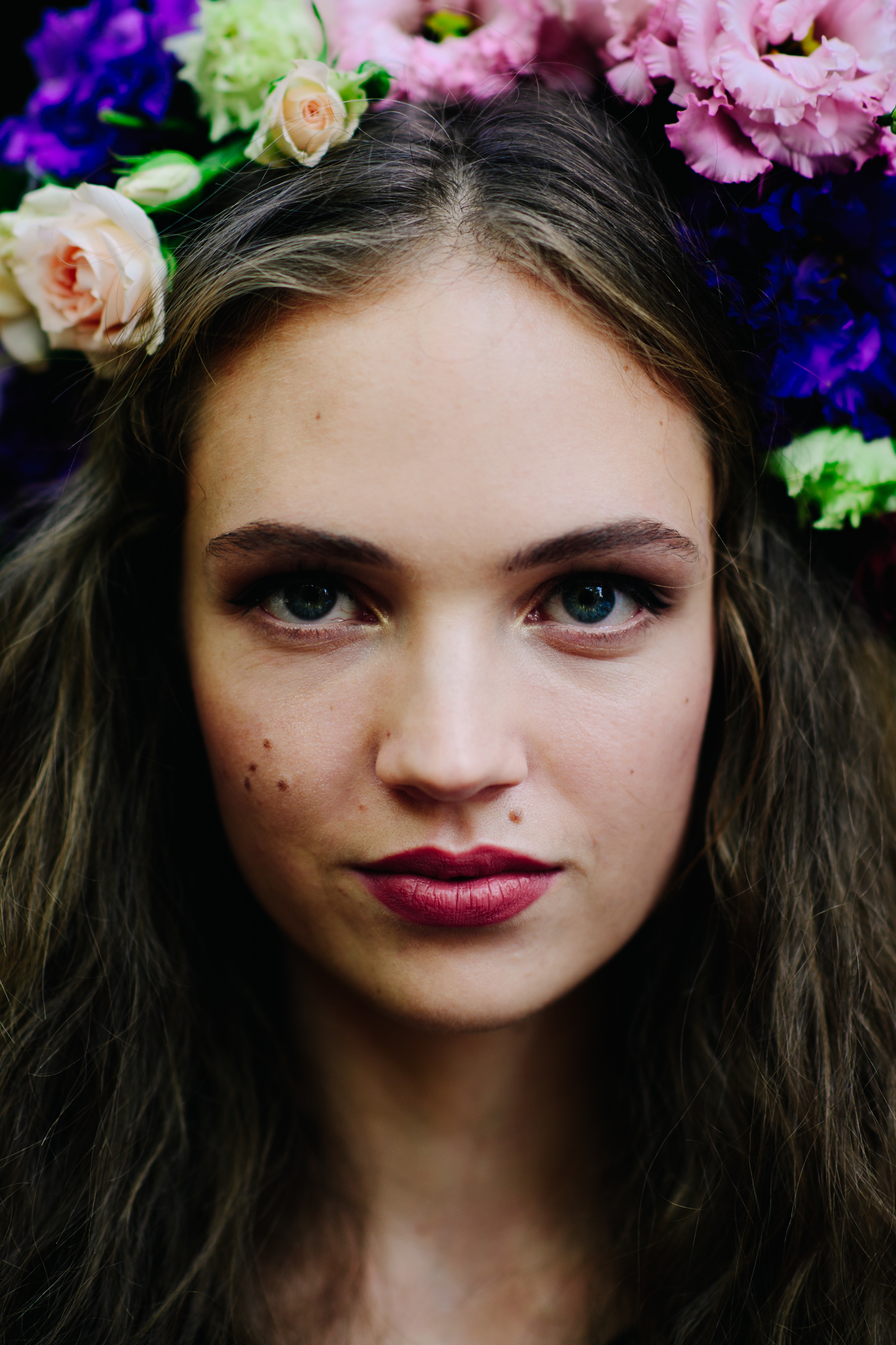 Portrait of a model with flowers after the show