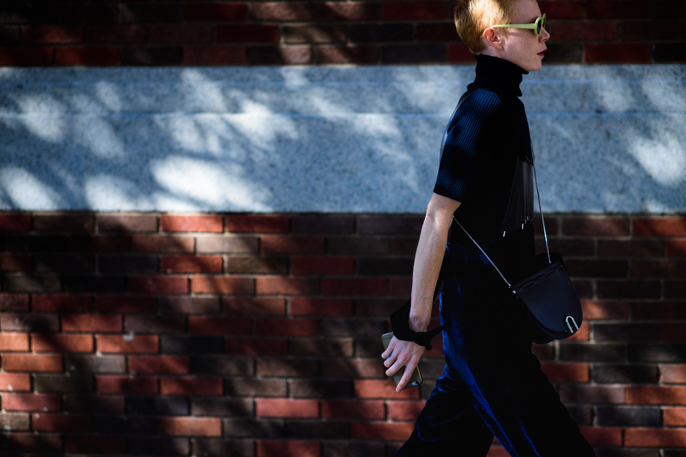 Woman wearing green sun glasses