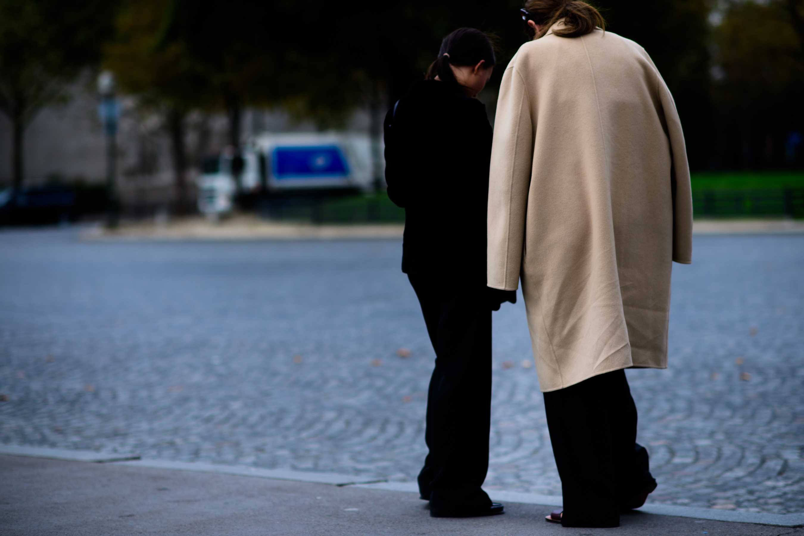 Woman wearing beige coat after show