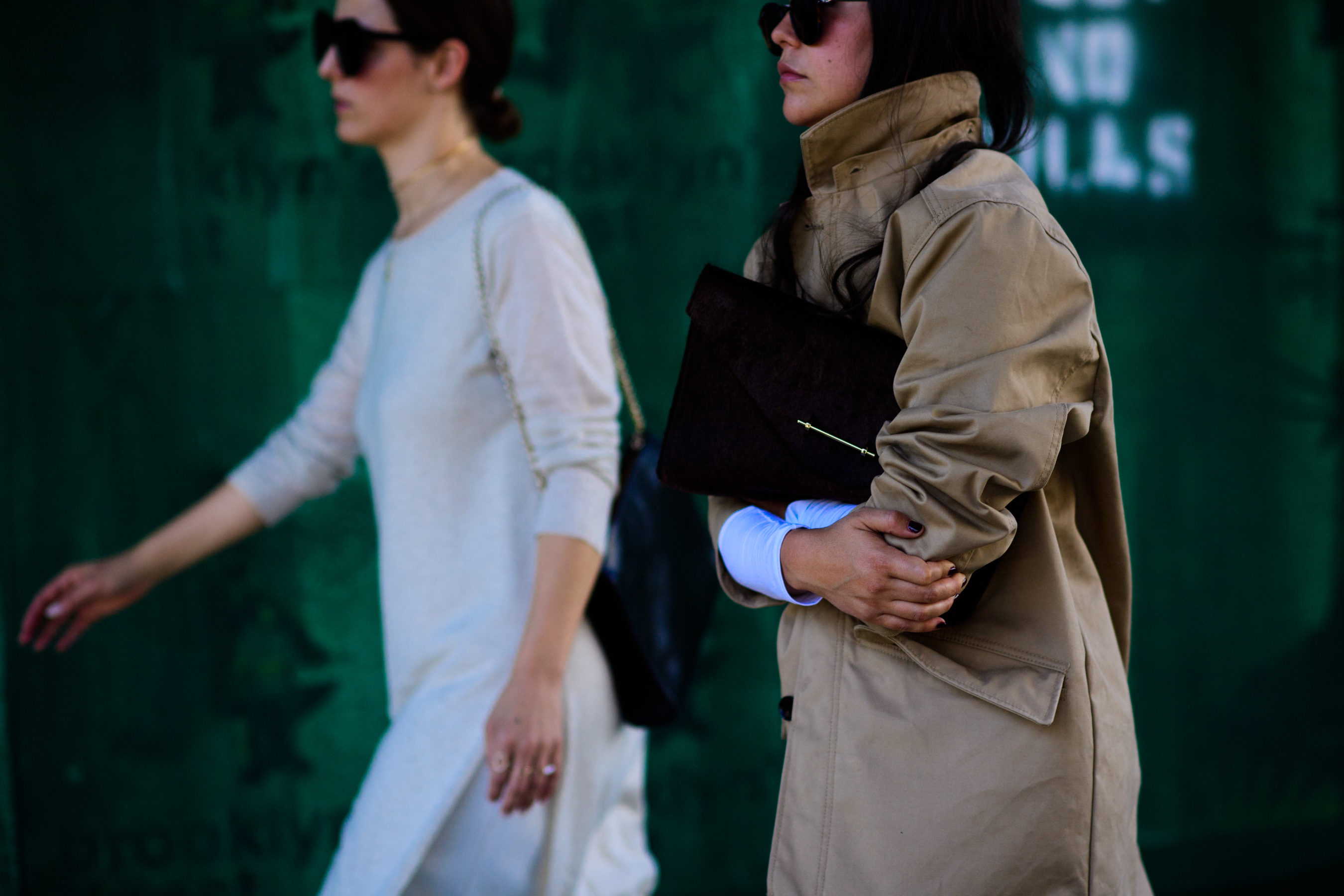 Two women wearing beige