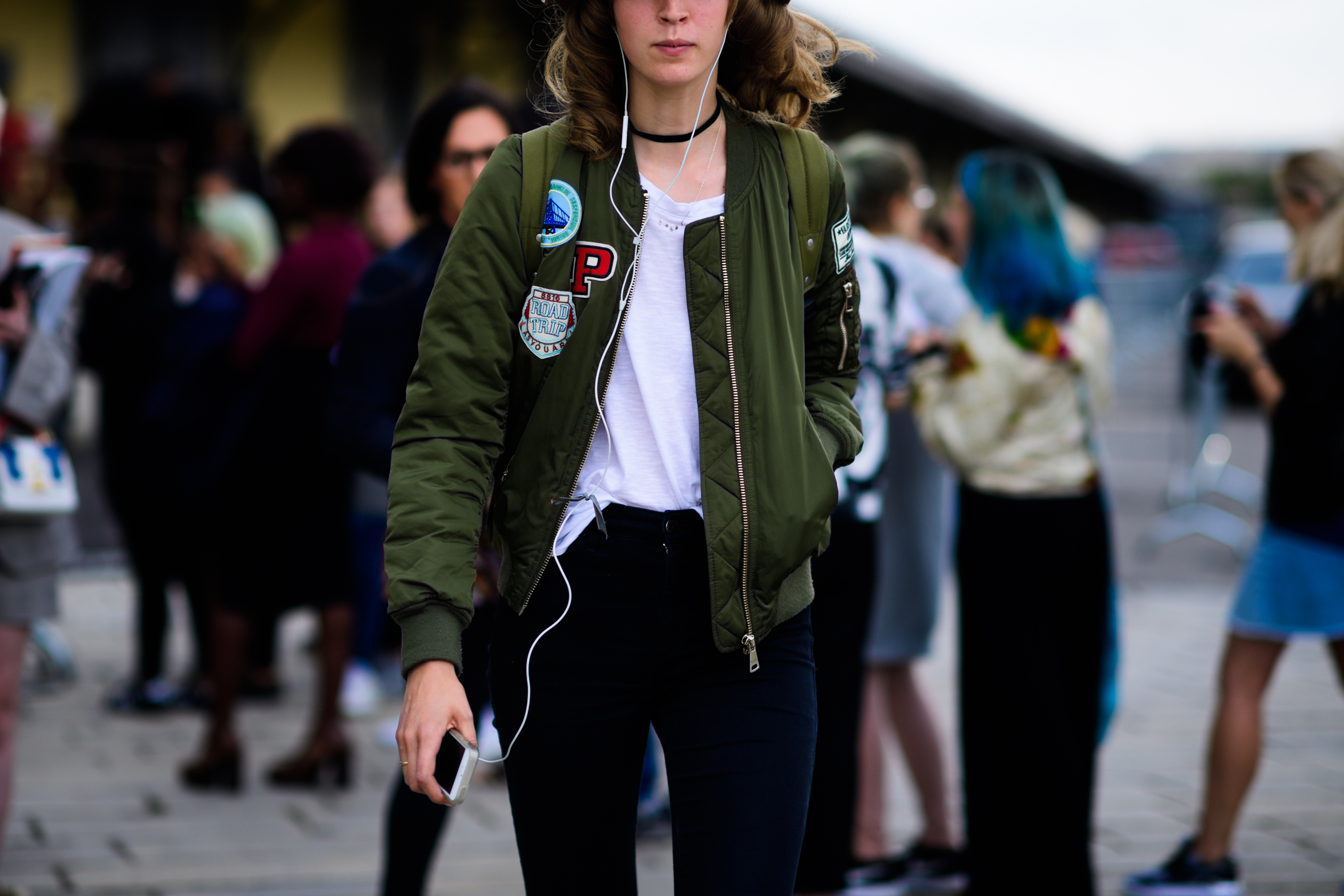 Model wearing green bomber after Gucci