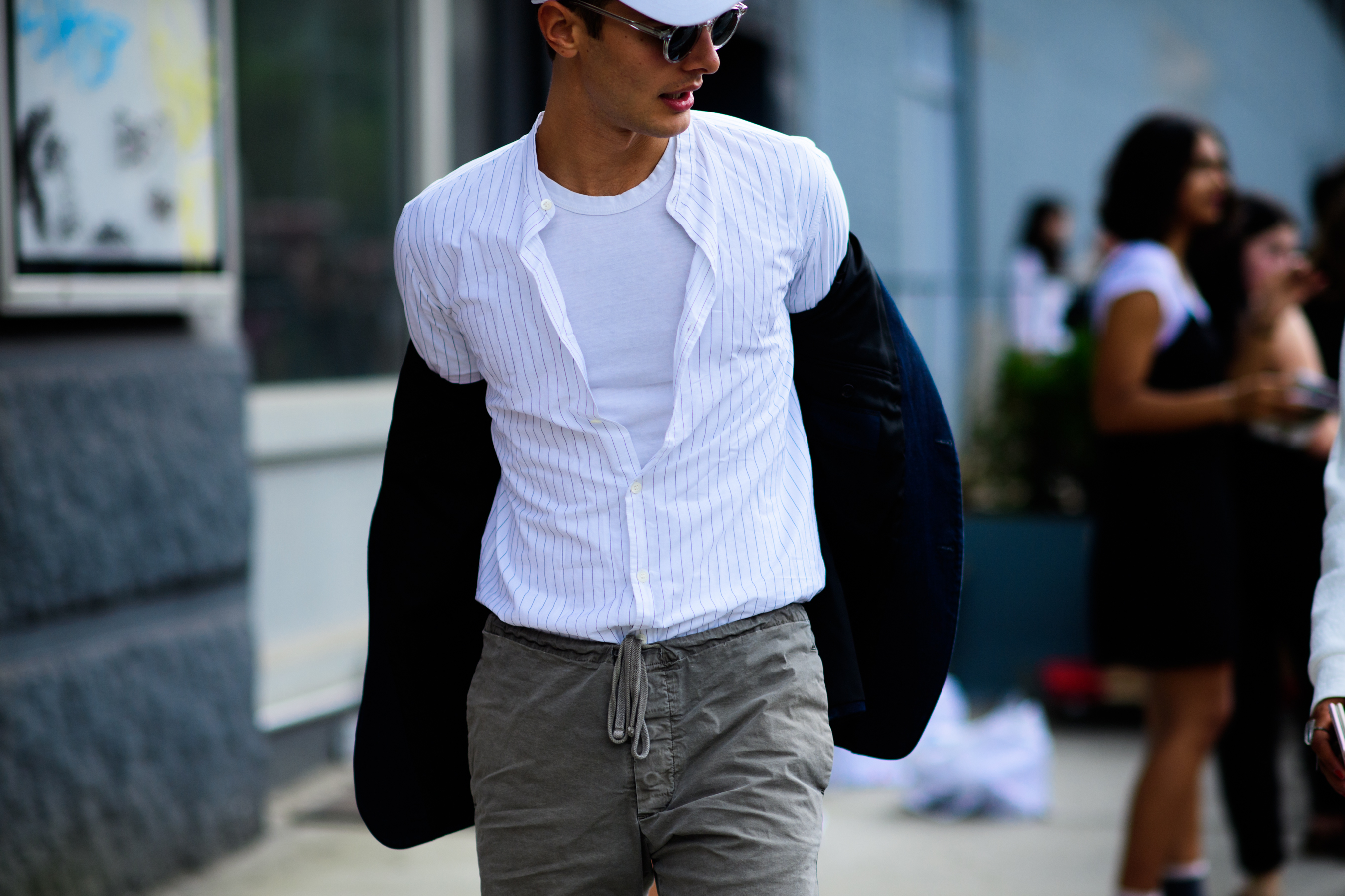 Man wearing white shirt and glasses