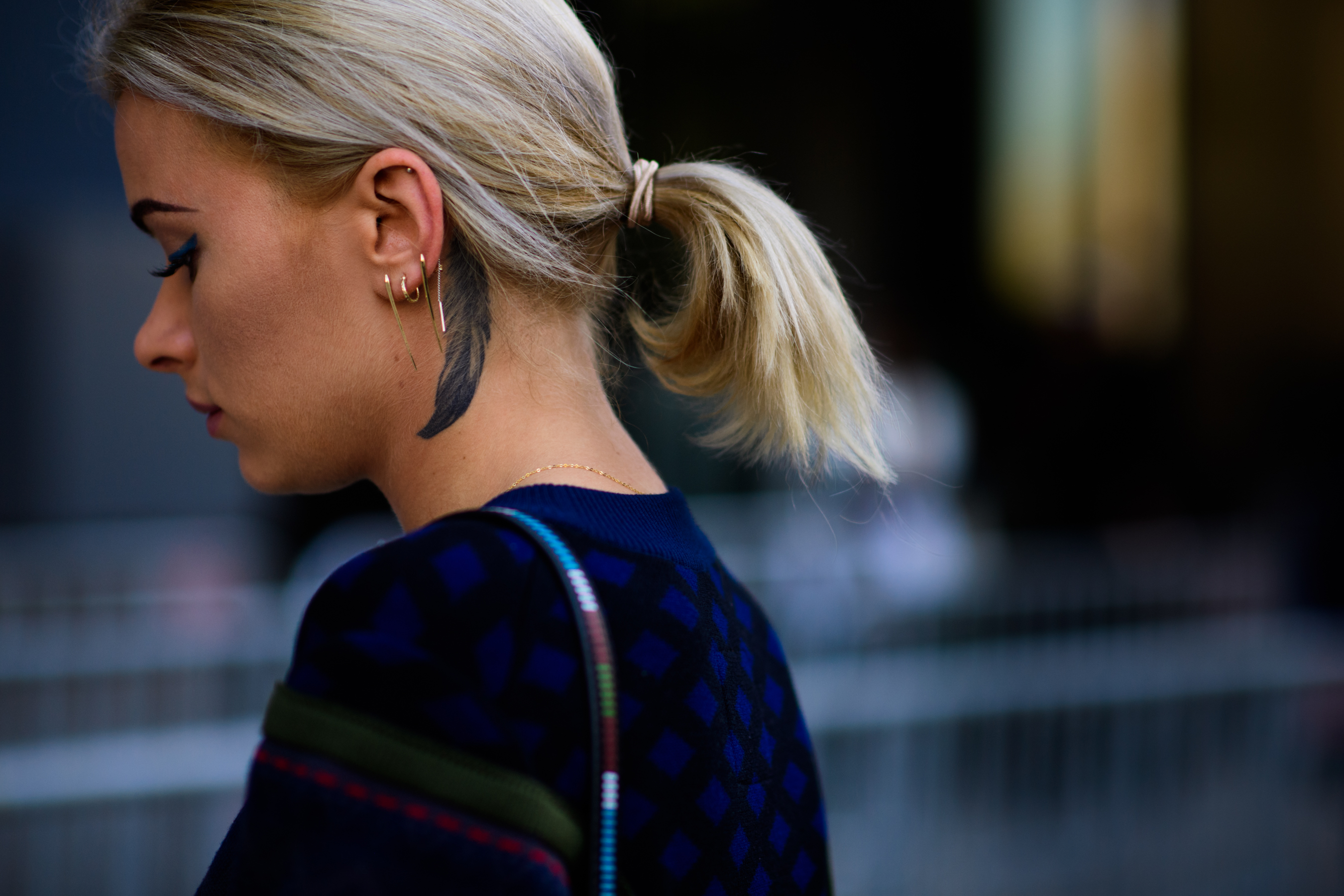 Woman with feather tattoo