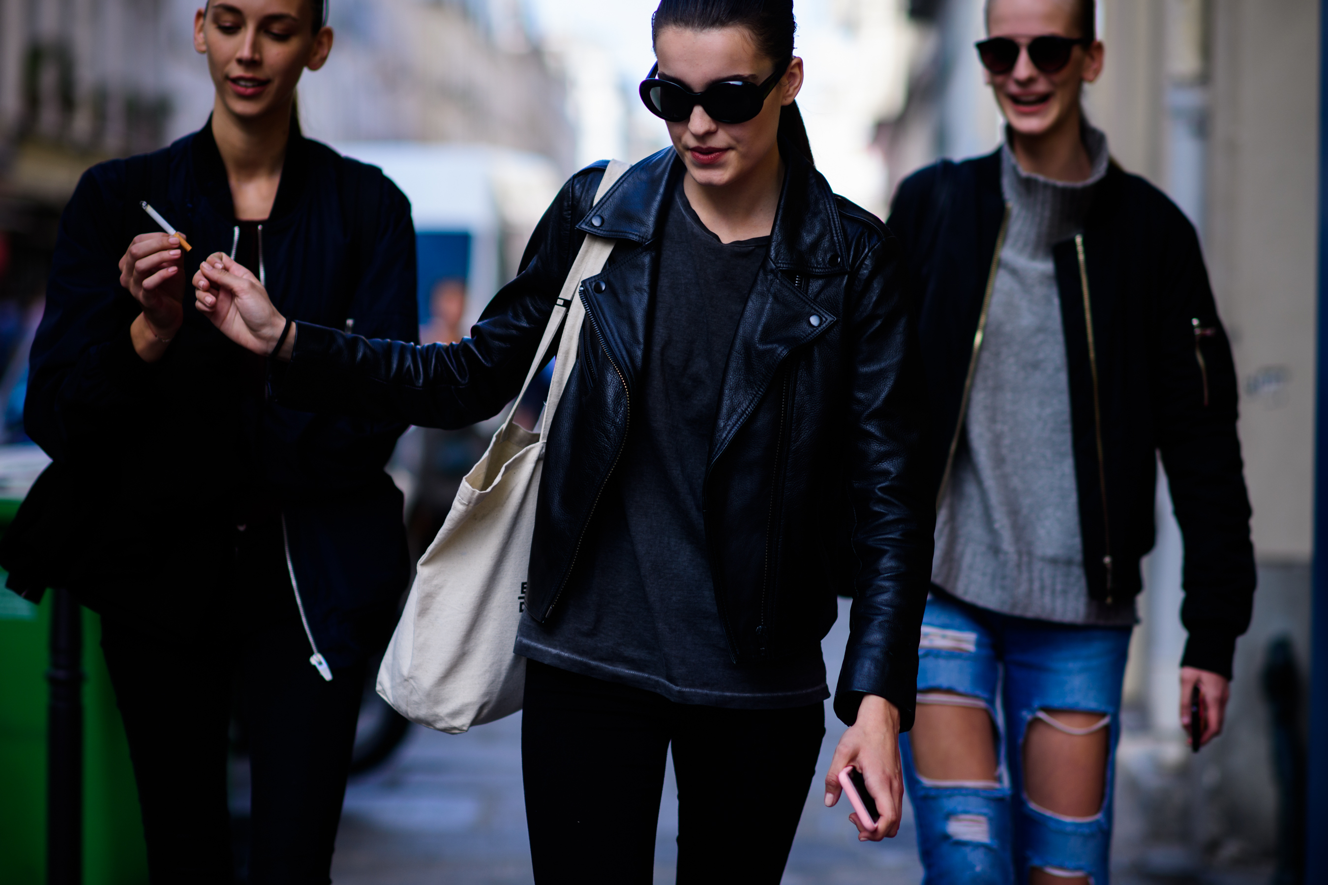 Three models wearing glasses after the show