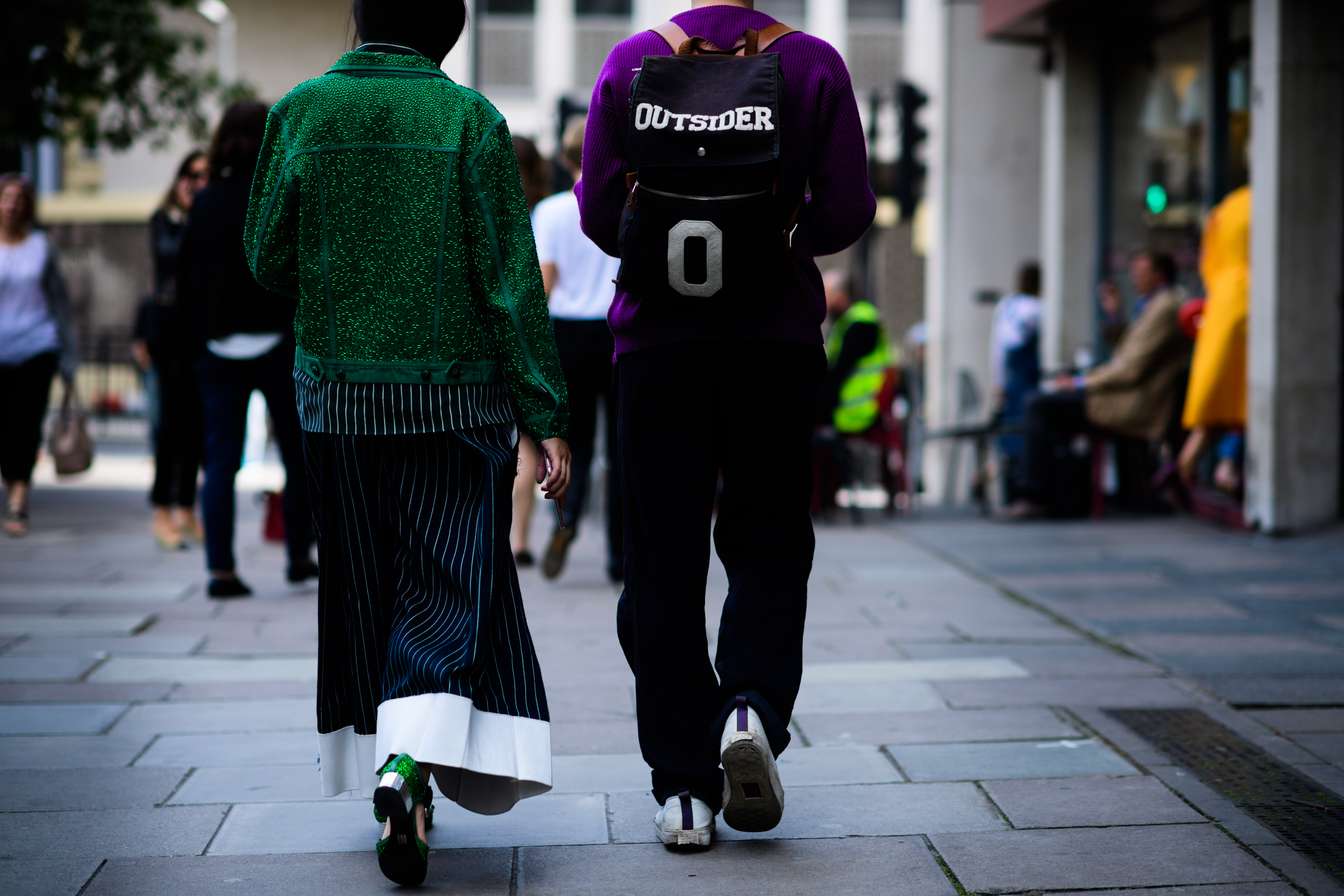 Woman in green and man in purple
