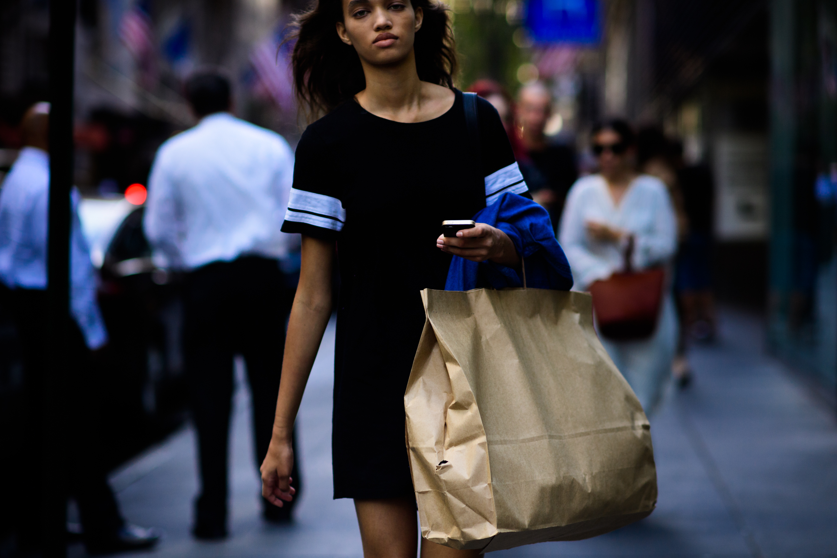 Model with paper bag after the show