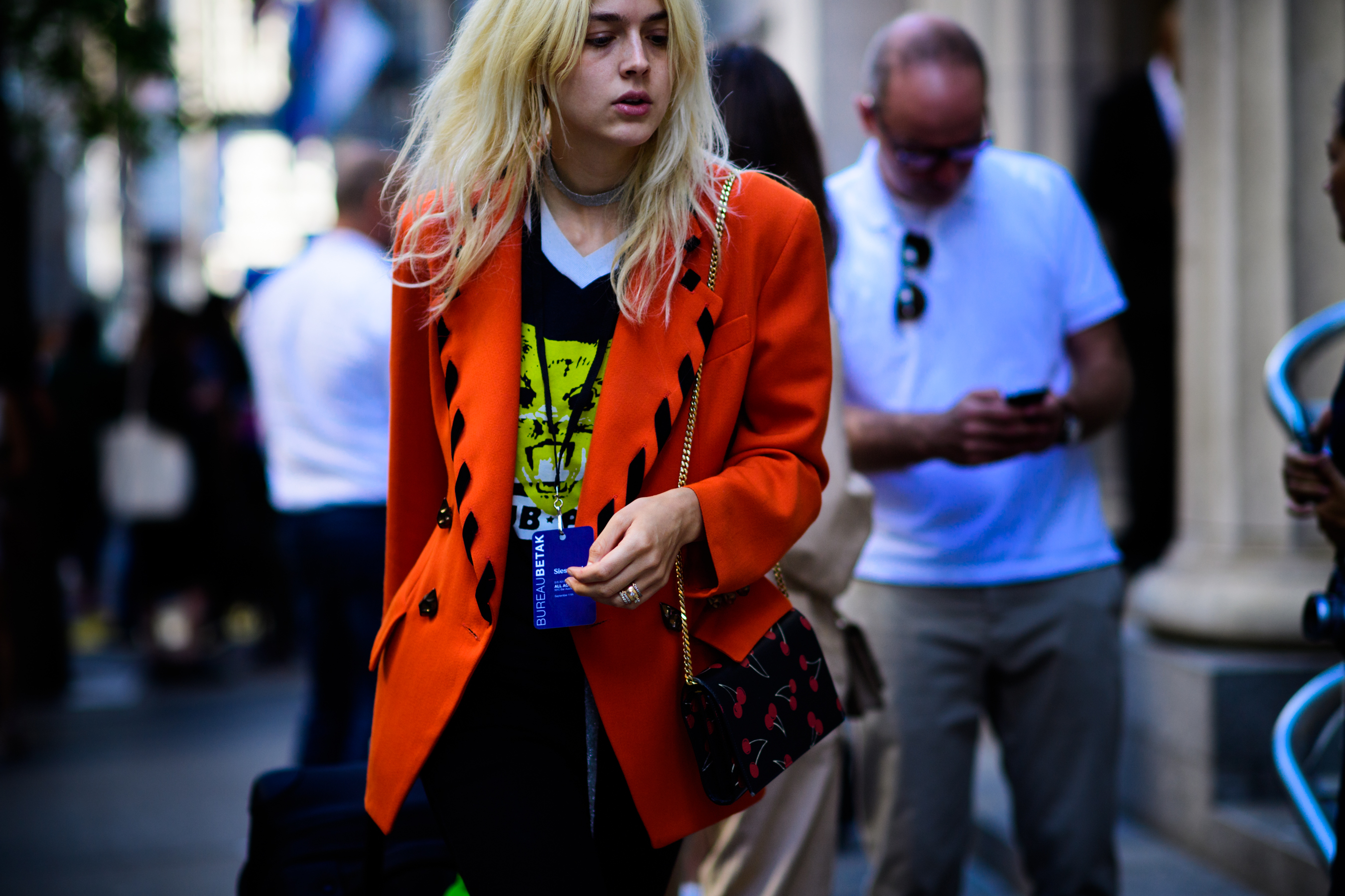 Woman wearing orange blazer