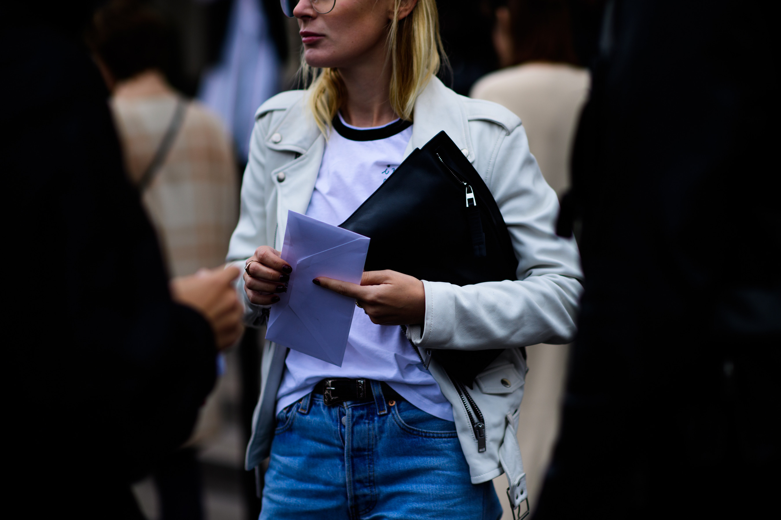 Girl wearing white leather jacket